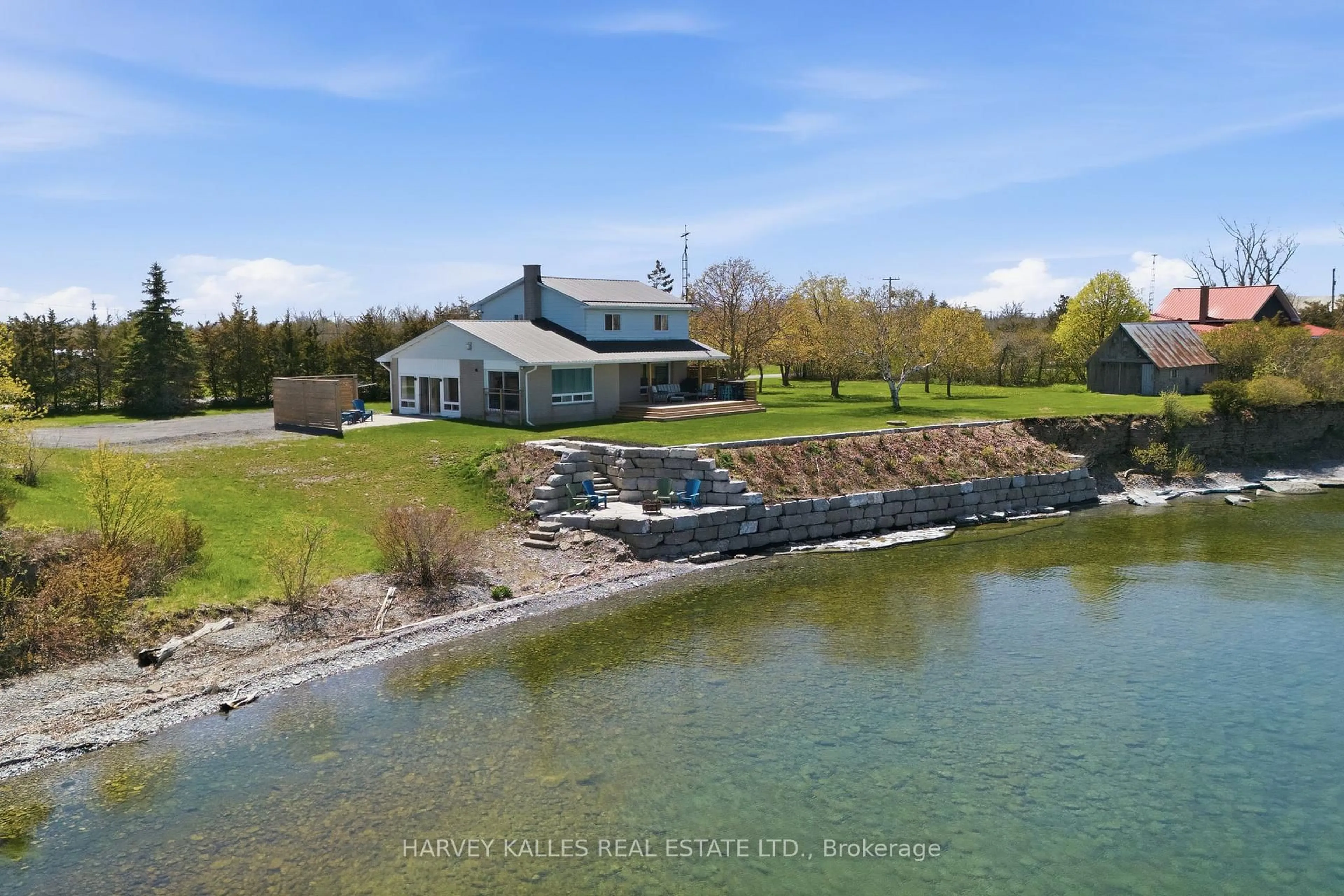 A pic from outside/outdoor area/front of a property/back of a property/a pic from drone, water/lake/river/ocean view for 4631 County Rd 13 Rd, Prince Edward County Ontario K0K 2P0