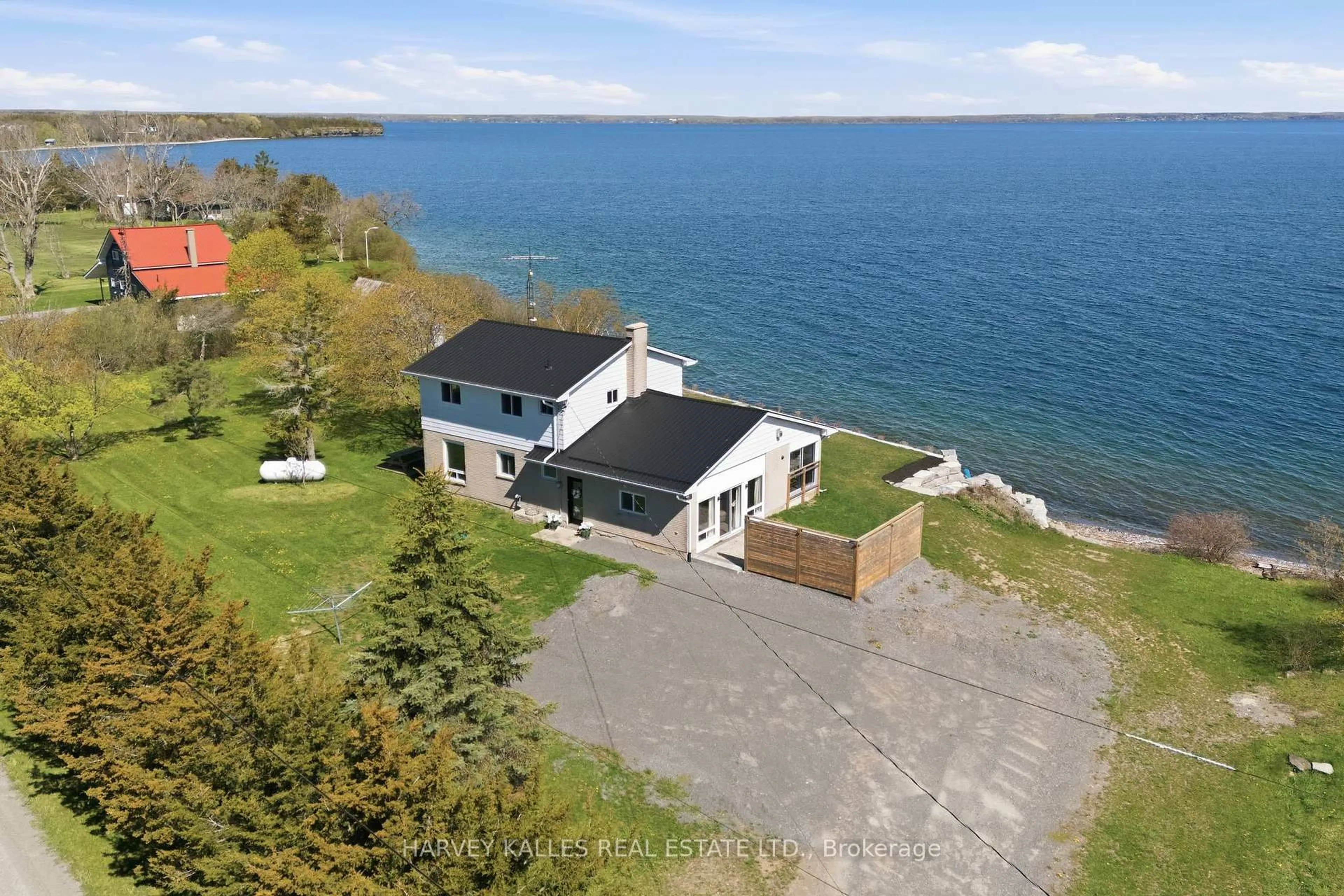 A pic from outside/outdoor area/front of a property/back of a property/a pic from drone, water/lake/river/ocean view for 4631 County Rd 13 Rd, Prince Edward County Ontario K0K 2P0