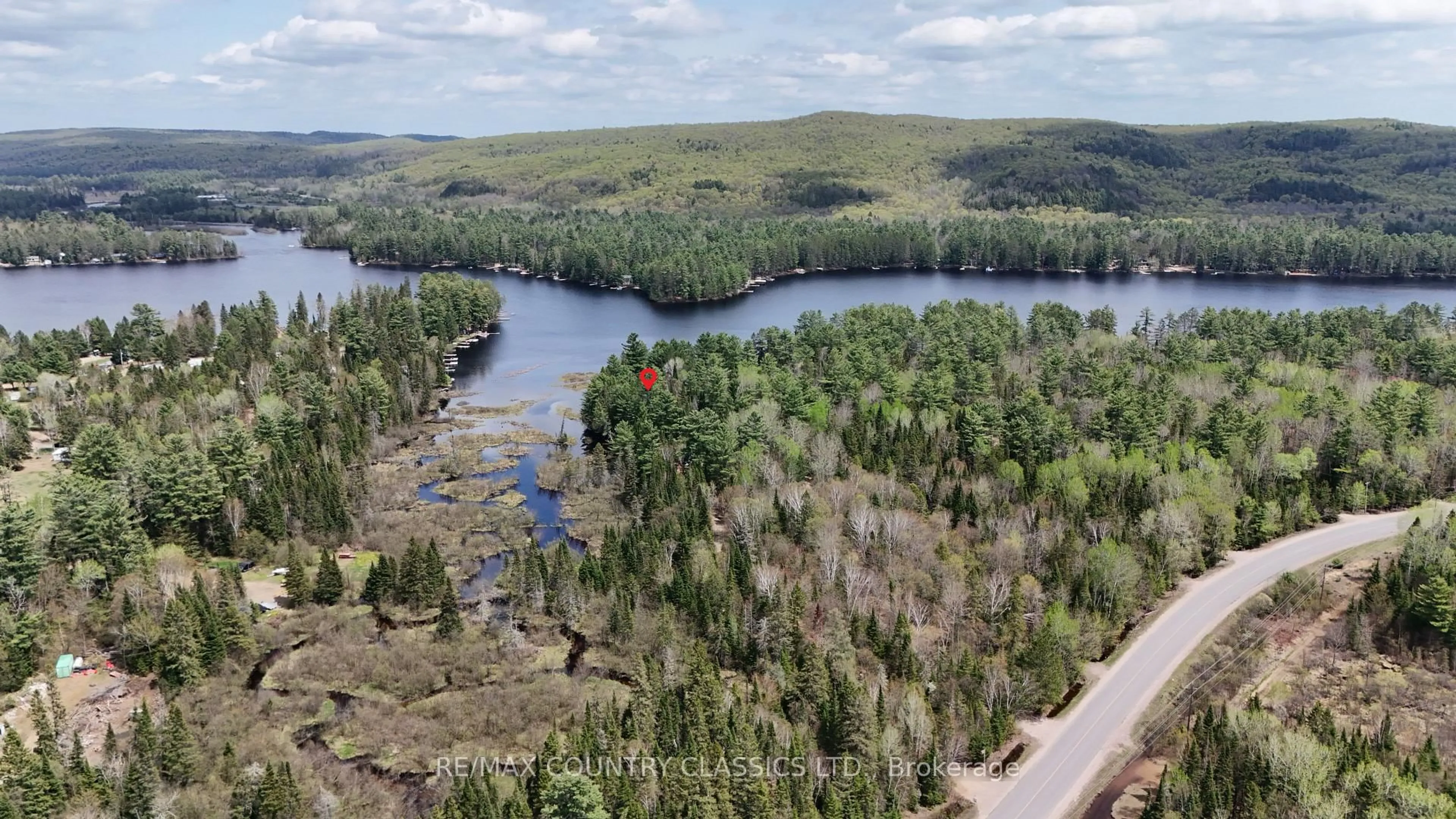 A pic from outside/outdoor area/front of a property/back of a property/a pic from drone, water/lake/river/ocean view for 4501 Elephant Lake Rd, Dysart et al Ontario K0L 2A0