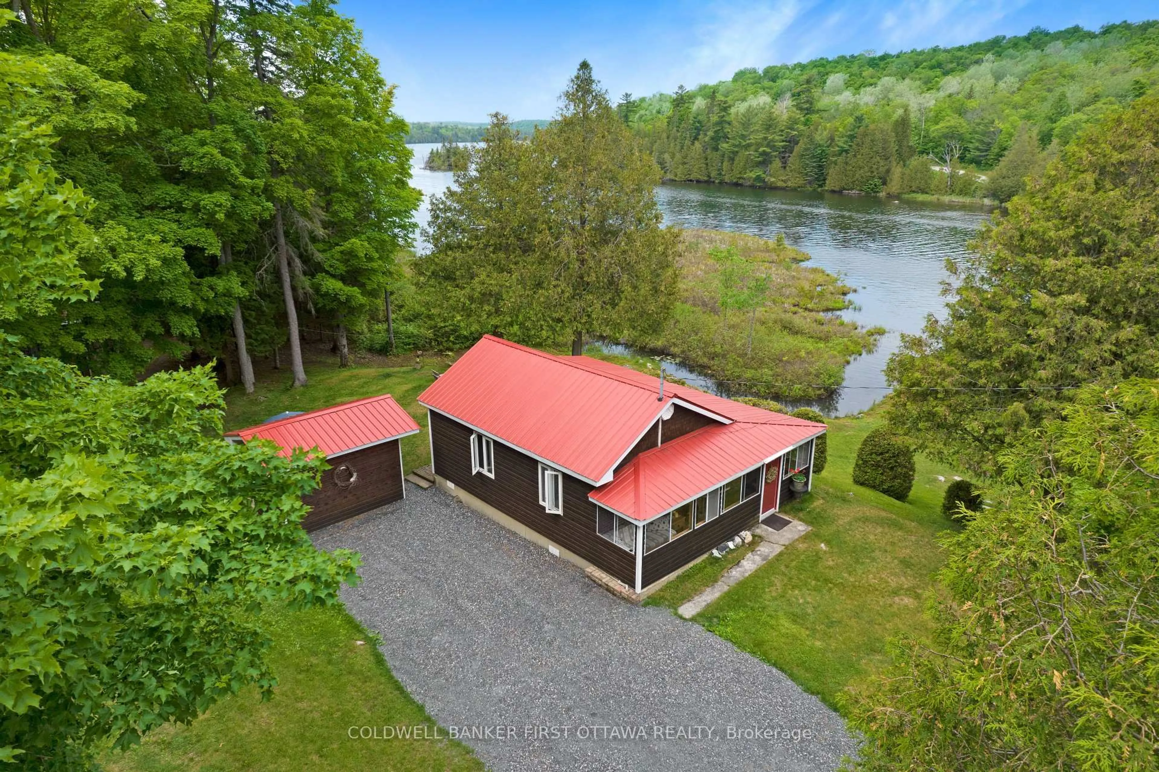 A pic from outside/outdoor area/front of a property/back of a property/a pic from drone, water/lake/river/ocean view for 1025 ARCOL Rd, Ompah Ontario K0H 2J0