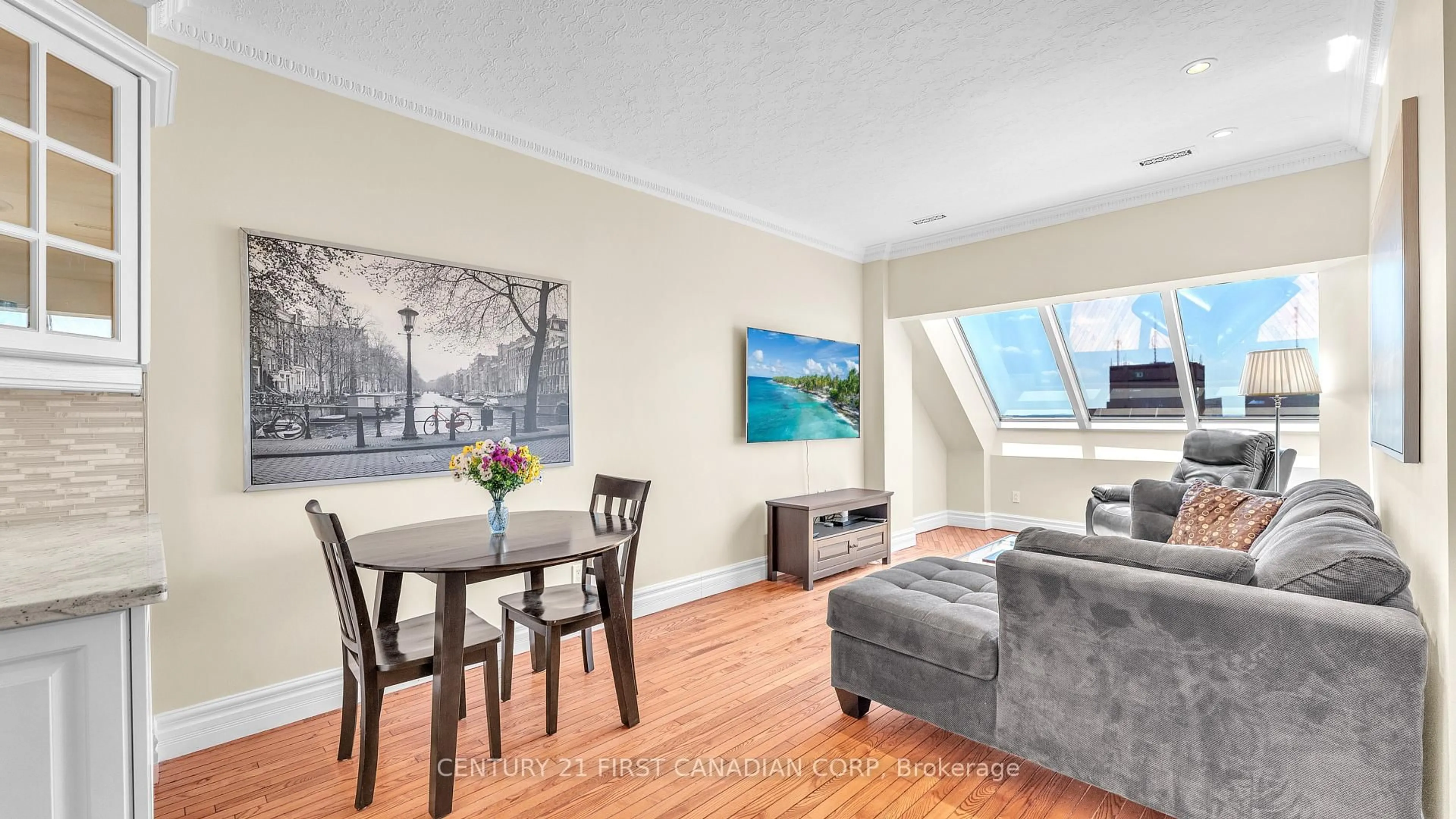 Living room with furniture, wood/laminate floor for 389 Dundas St #2404, London East Ontario N6B 3L5