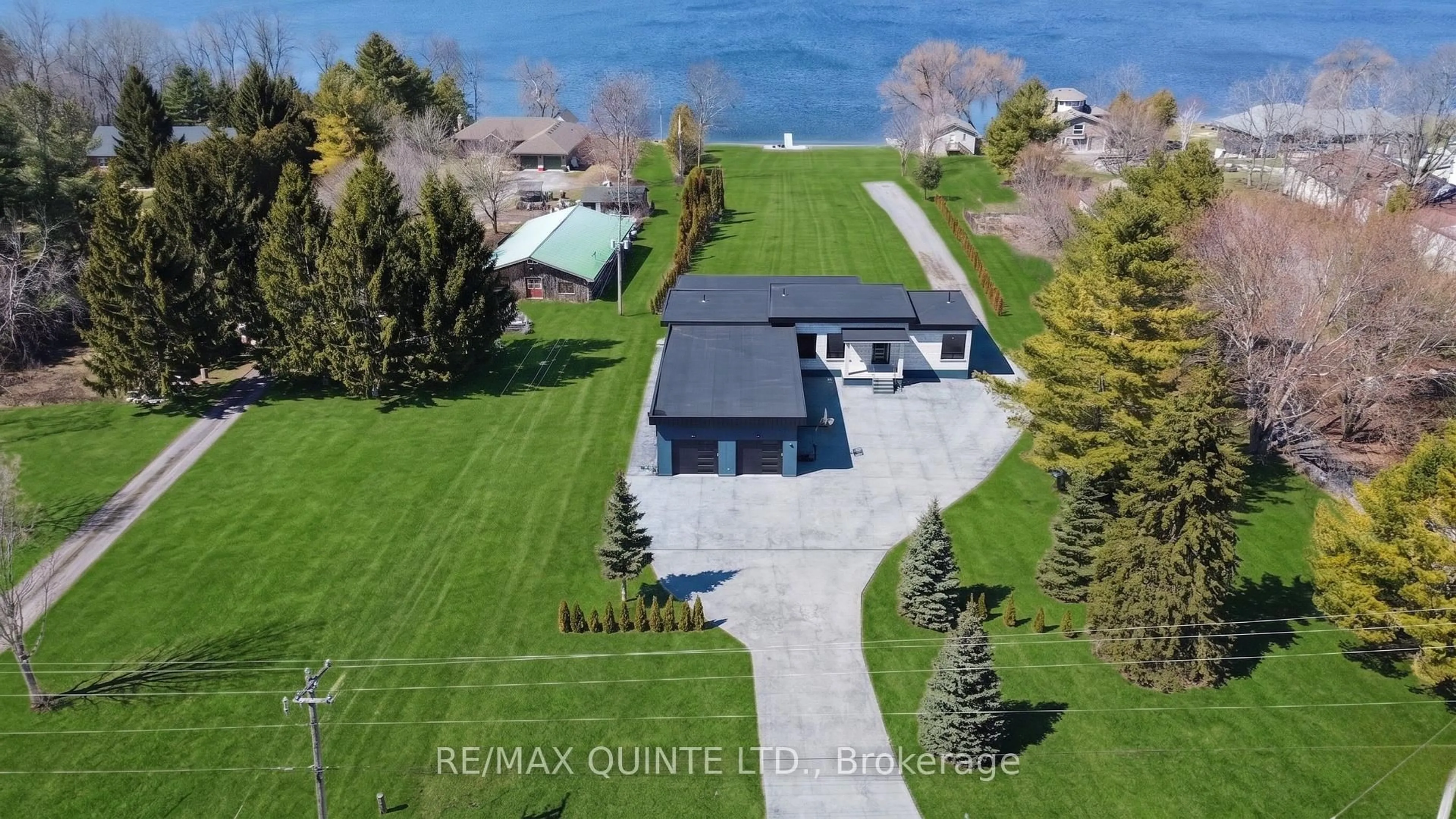 A pic from outside/outdoor area/front of a property/back of a property/a pic from drone, water/lake/river/ocean view for 2528 County Road 3, Prince Edward County Ontario K0K 1L0