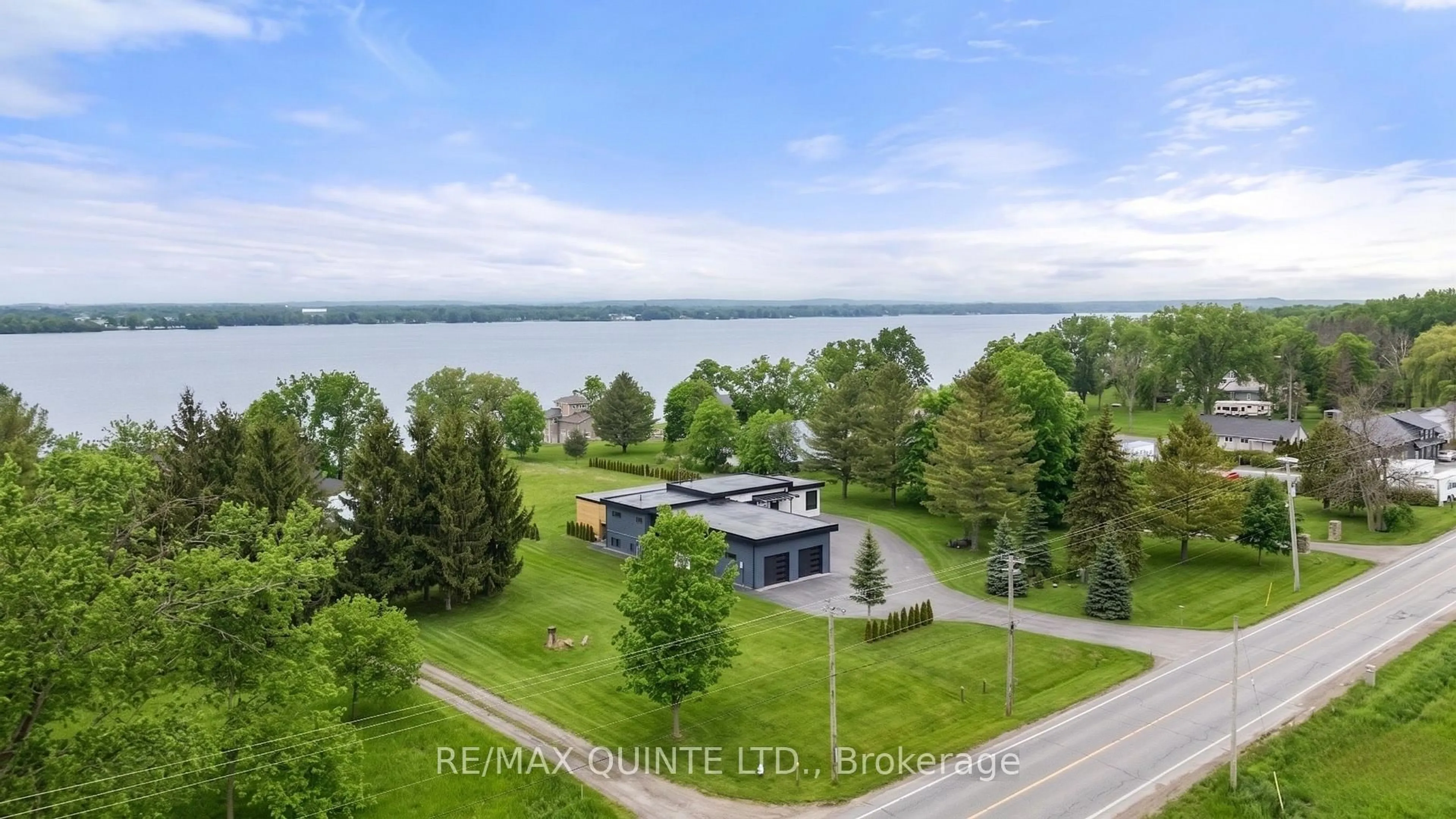 A pic from outside/outdoor area/front of a property/back of a property/a pic from drone, water/lake/river/ocean view for 2528 County Road 3, Prince Edward County Ontario K0K 1L0