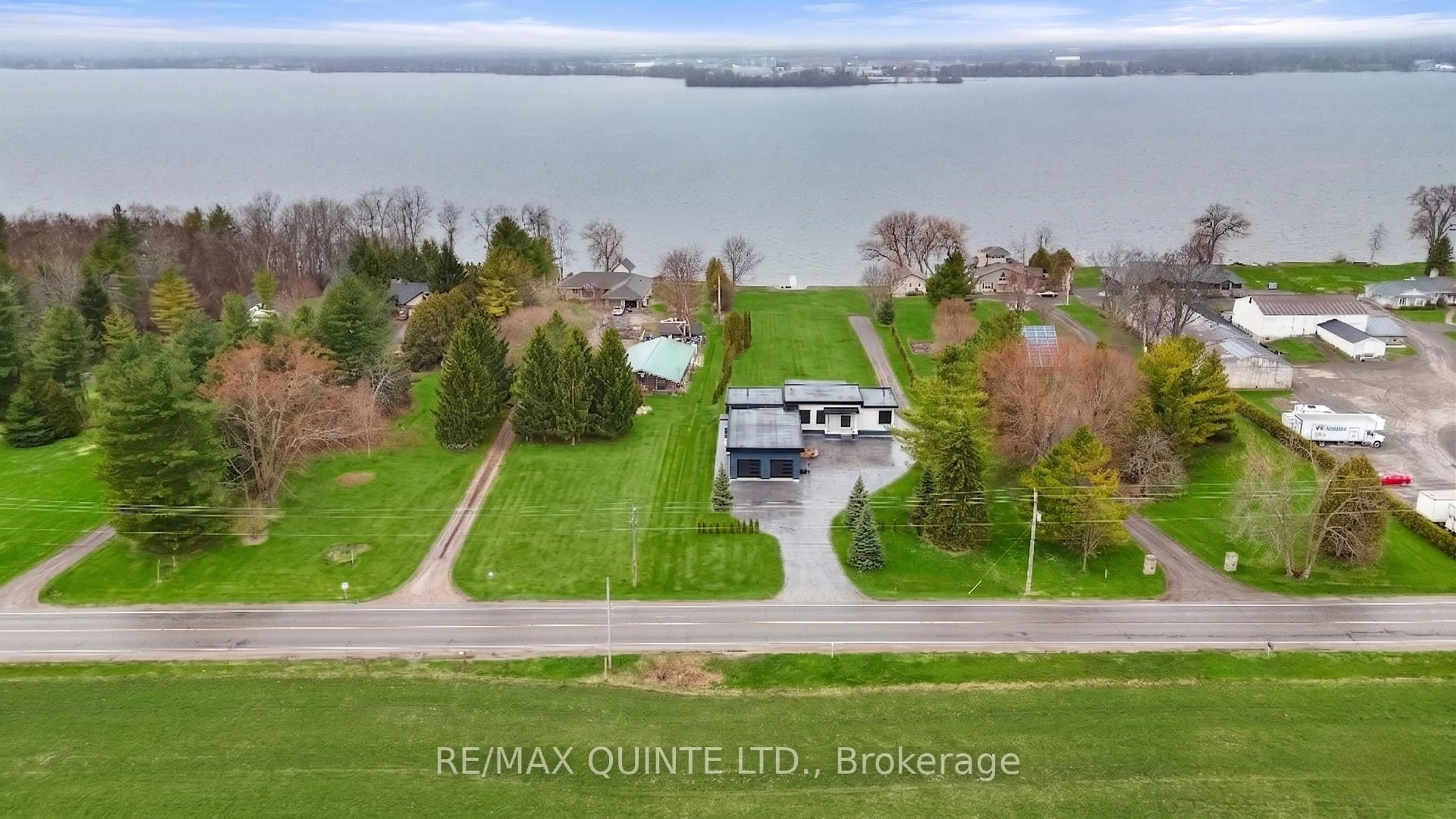 A pic from outside/outdoor area/front of a property/back of a property/a pic from drone, water/lake/river/ocean view for 2528 County Road 3, Prince Edward County Ontario K0K 1L0