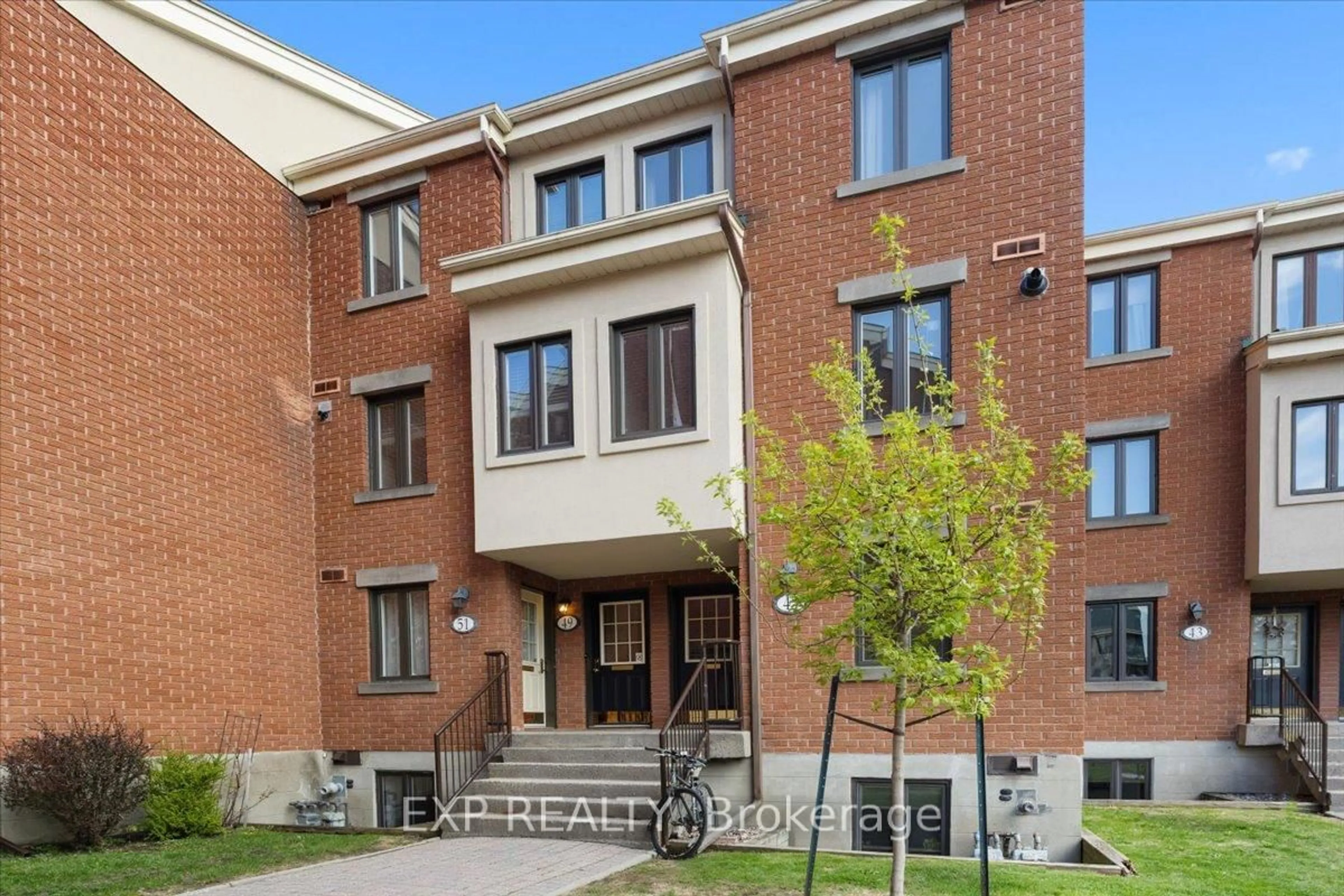 Home with brick exterior material, street for 49 Crispin Private, Ottawa Ontario K1K 2T7