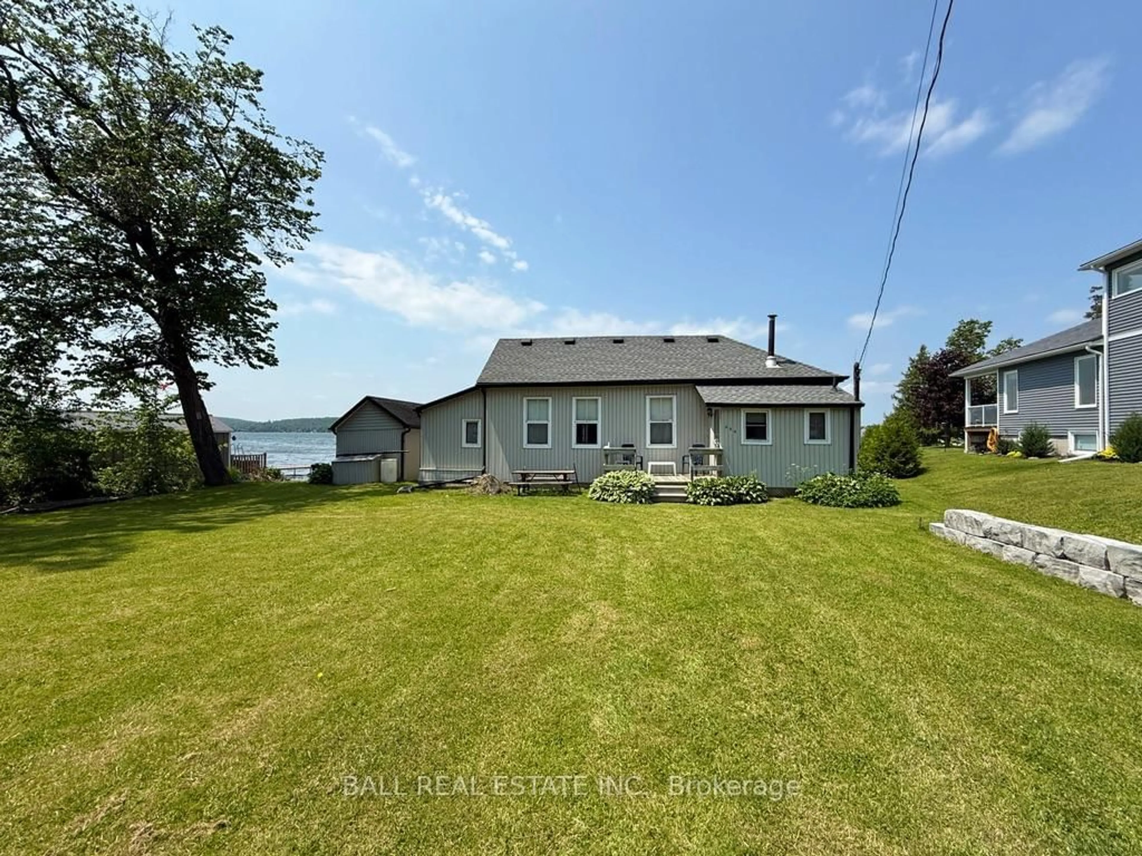A pic from outside/outdoor area/front of a property/back of a property/a pic from drone, water/lake/river/ocean view for 654 Hatton Ave, Selwyn Ontario K0L 1H0