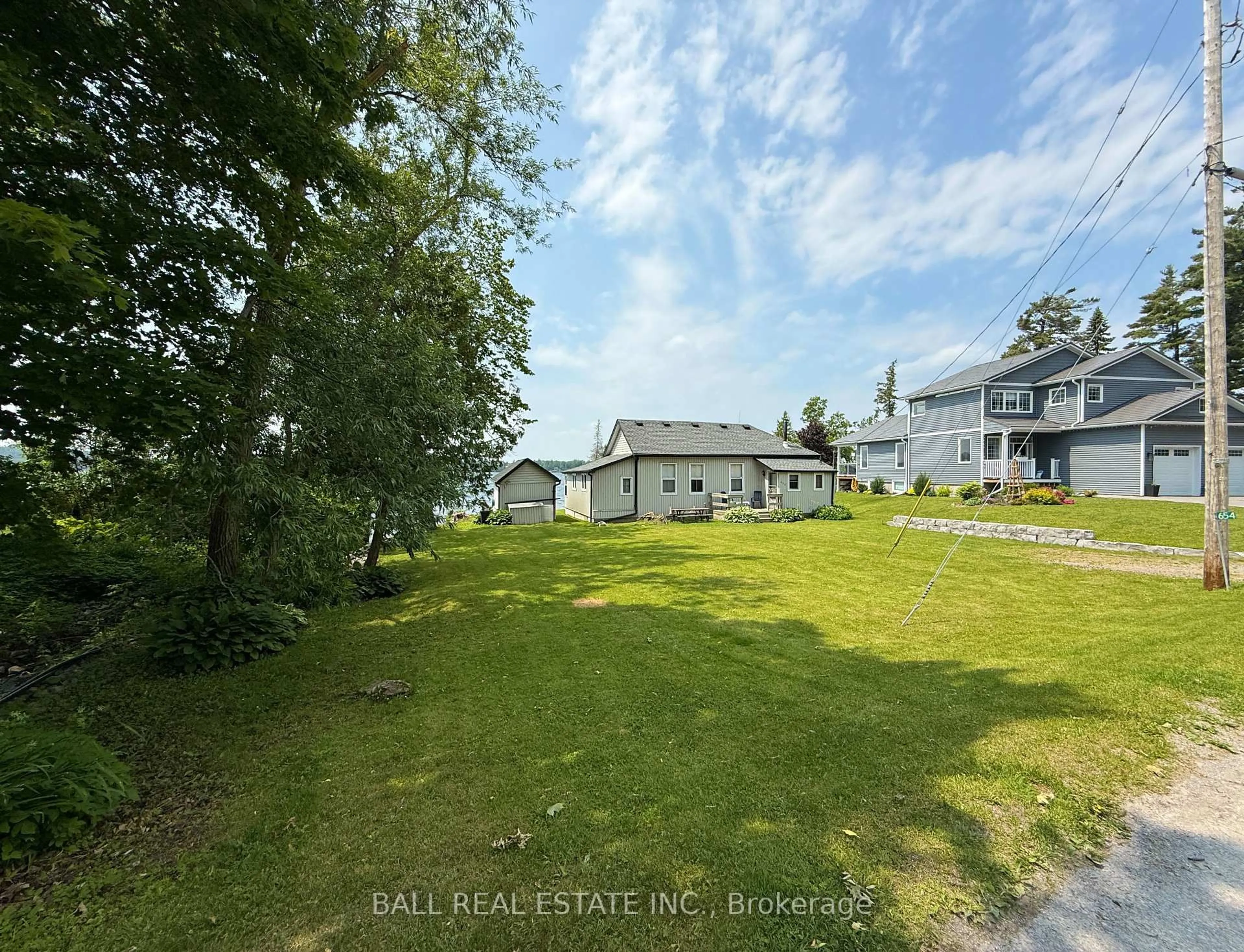 A pic from outside/outdoor area/front of a property/back of a property/a pic from drone, water/lake/river/ocean view for 654 Hatton Ave, Selwyn Ontario K0L 1H0