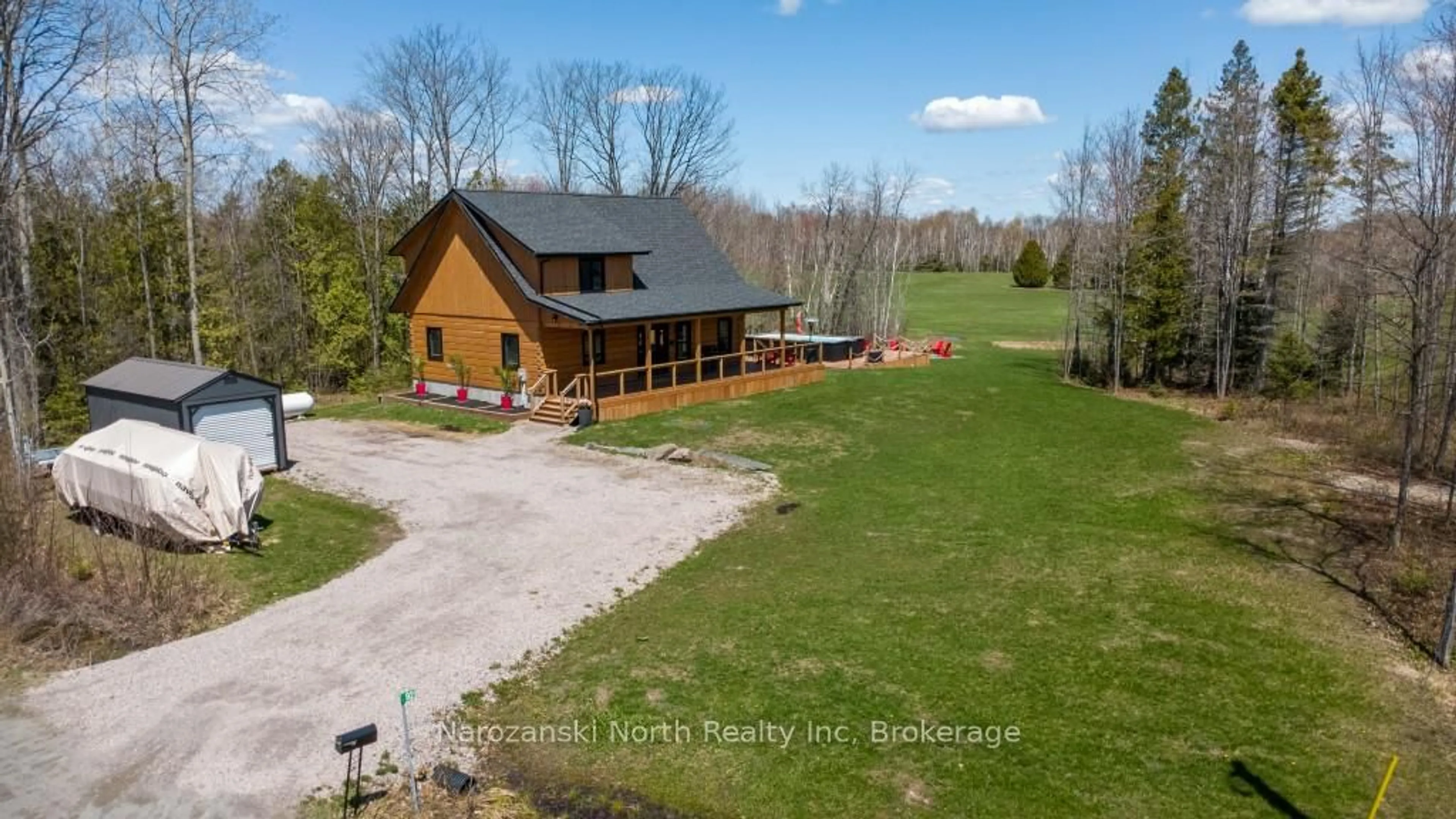 A pic from outside/outdoor area/front of a property/back of a property/a pic from drone, water/lake/river/ocean view for 92 Harold Fryer Dr, French River Ontario P0M 2K0