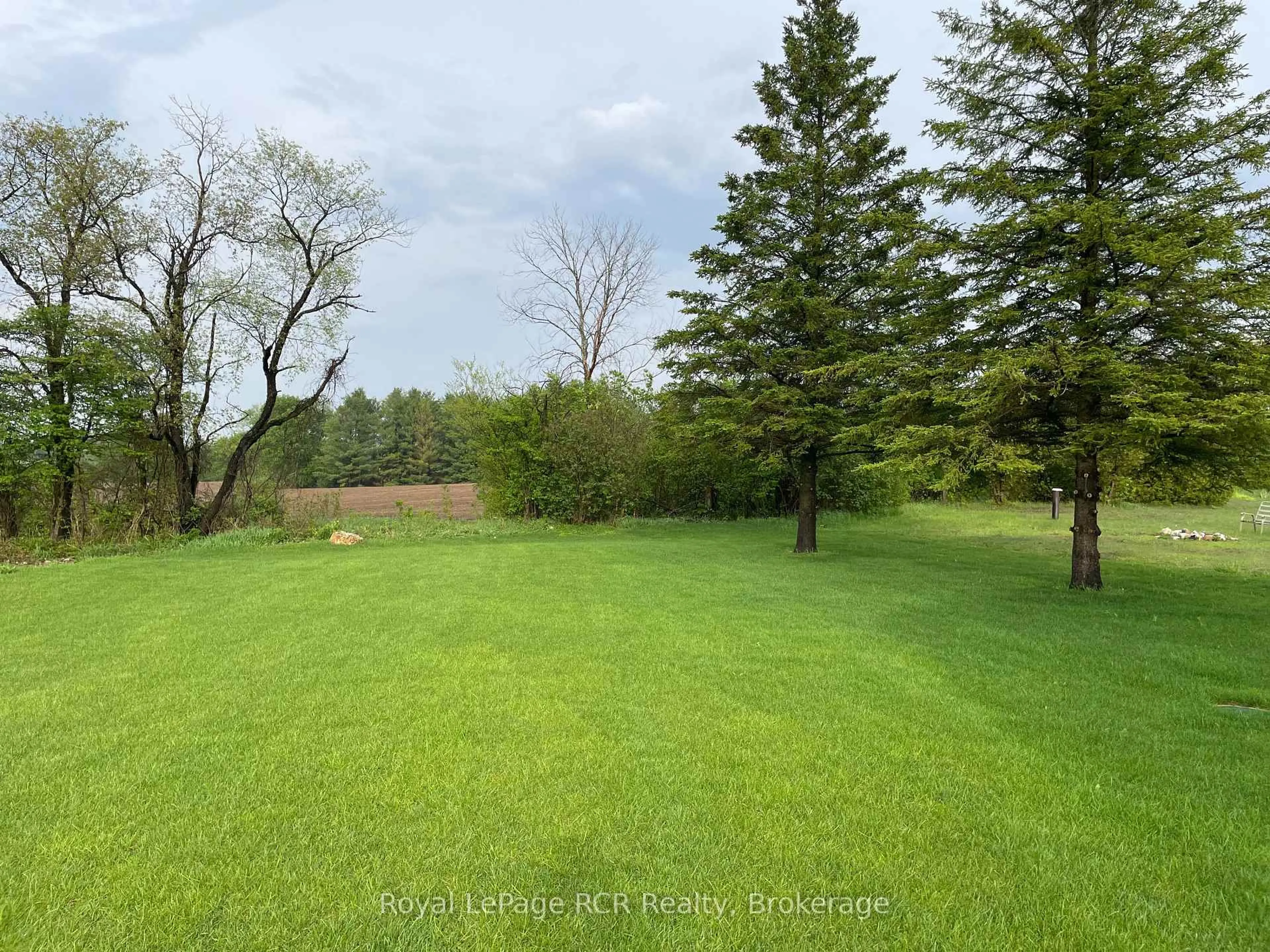 A pic from outside/outdoor area/front of a property/back of a property/a pic from drone, forest/trees view for 212 Spruce Dr, West Grey Ontario N4N 3B8