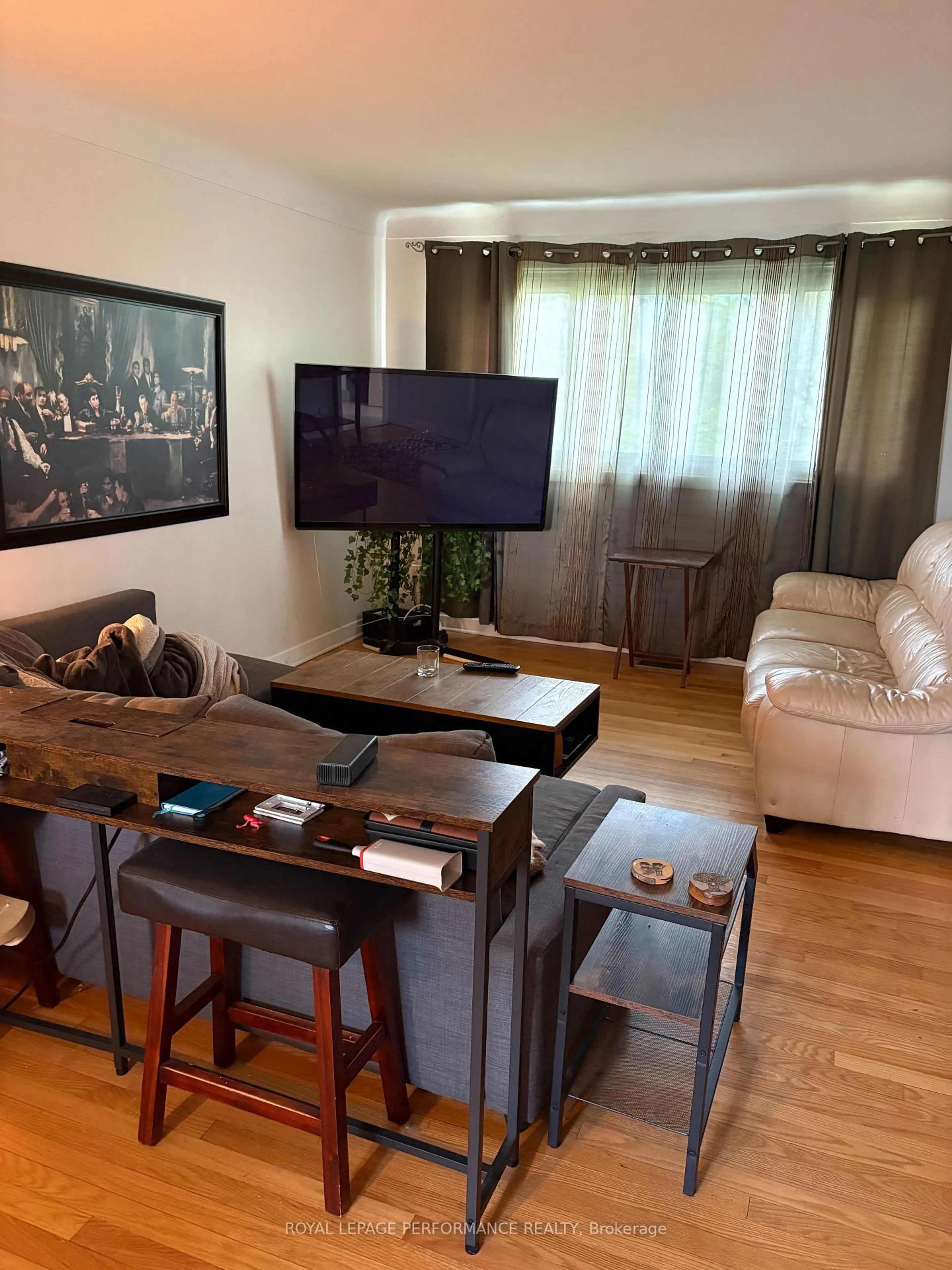 Living room with furniture, wood/laminate floor for 1779 Kerr Ave, Ottawa Ontario K2A 1H9