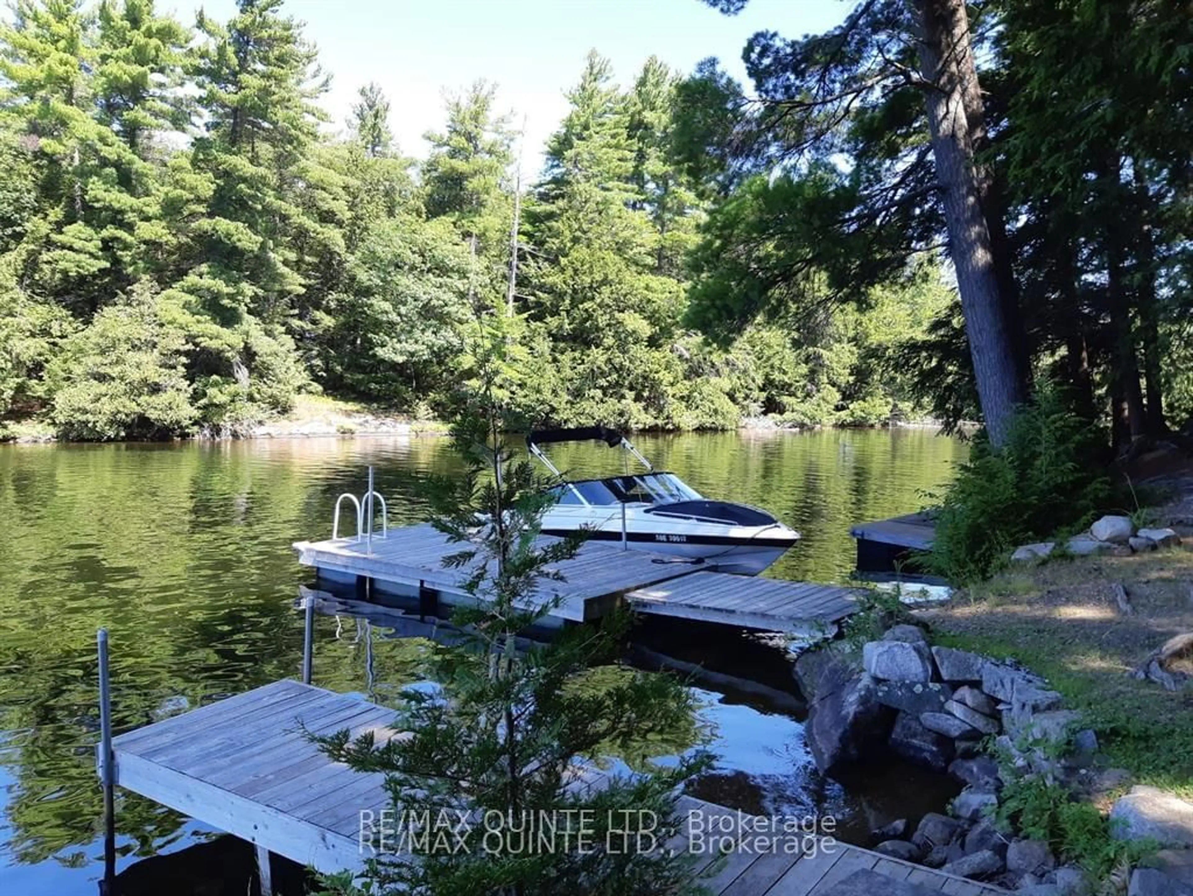 A pic from outside/outdoor area/front of a property/back of a property/a pic from drone, water/lake/river/ocean view for 1549 Gull Lake Lane, Arden Ontario K0H 1B0