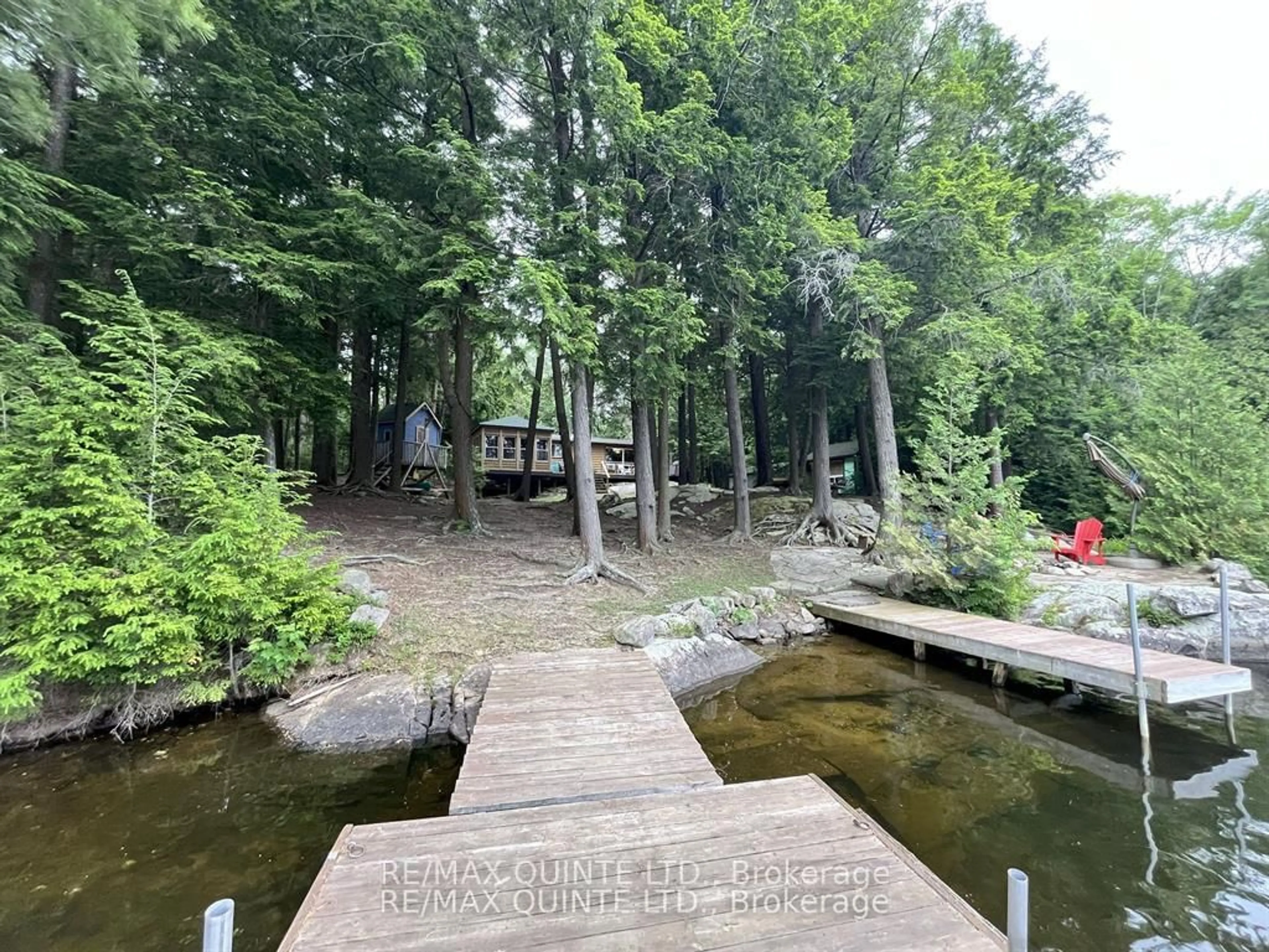 A pic from outside/outdoor area/front of a property/back of a property/a pic from drone, water/lake/river/ocean view for 1549 Gull Lake Lane, Arden Ontario K0H 1B0