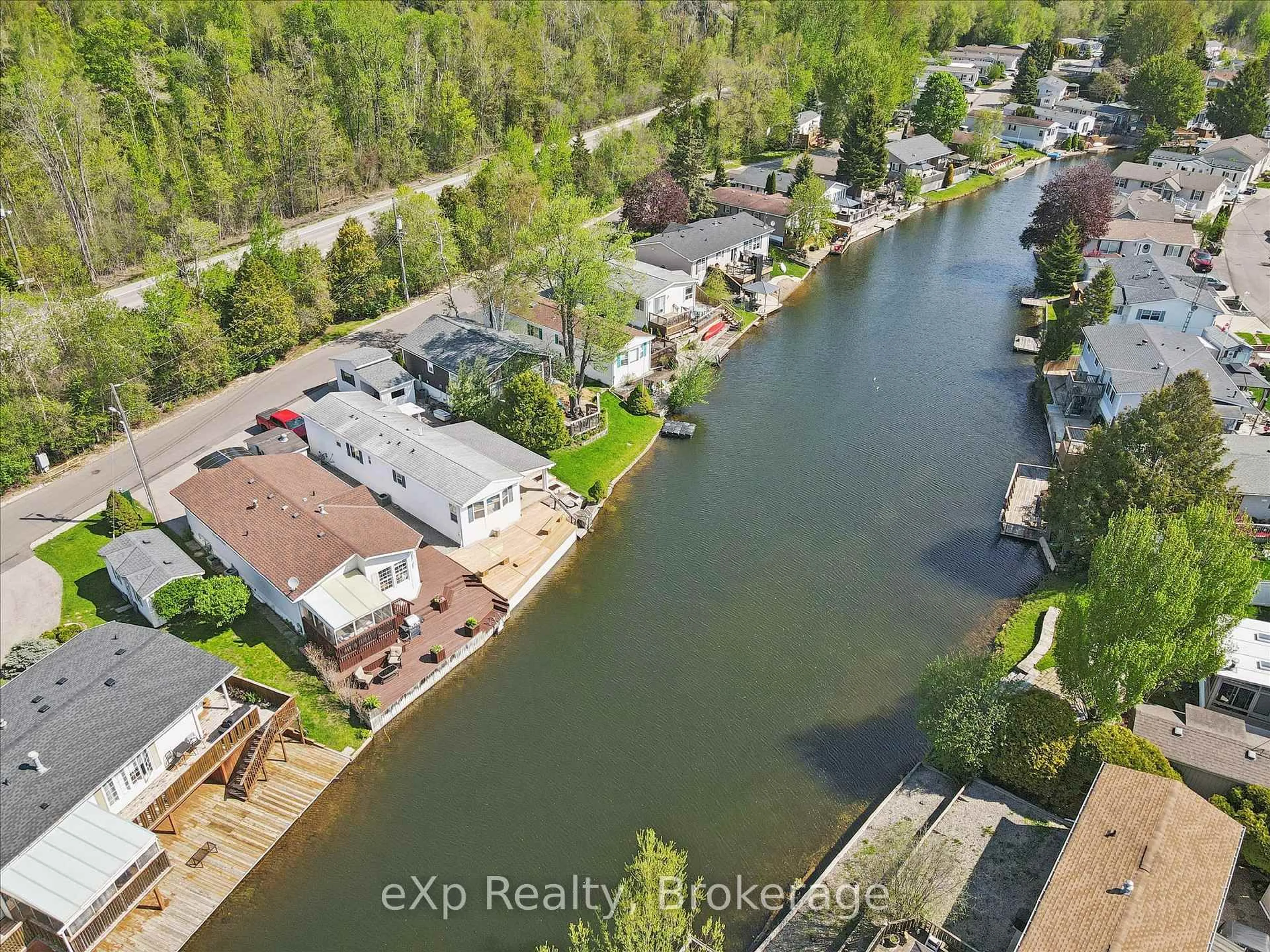 A pic from outside/outdoor area/front of a property/back of a property/a pic from drone, water/lake/river/ocean view for 18 Jasper Heights Private, Puslinch Ontario N0B 2C0
