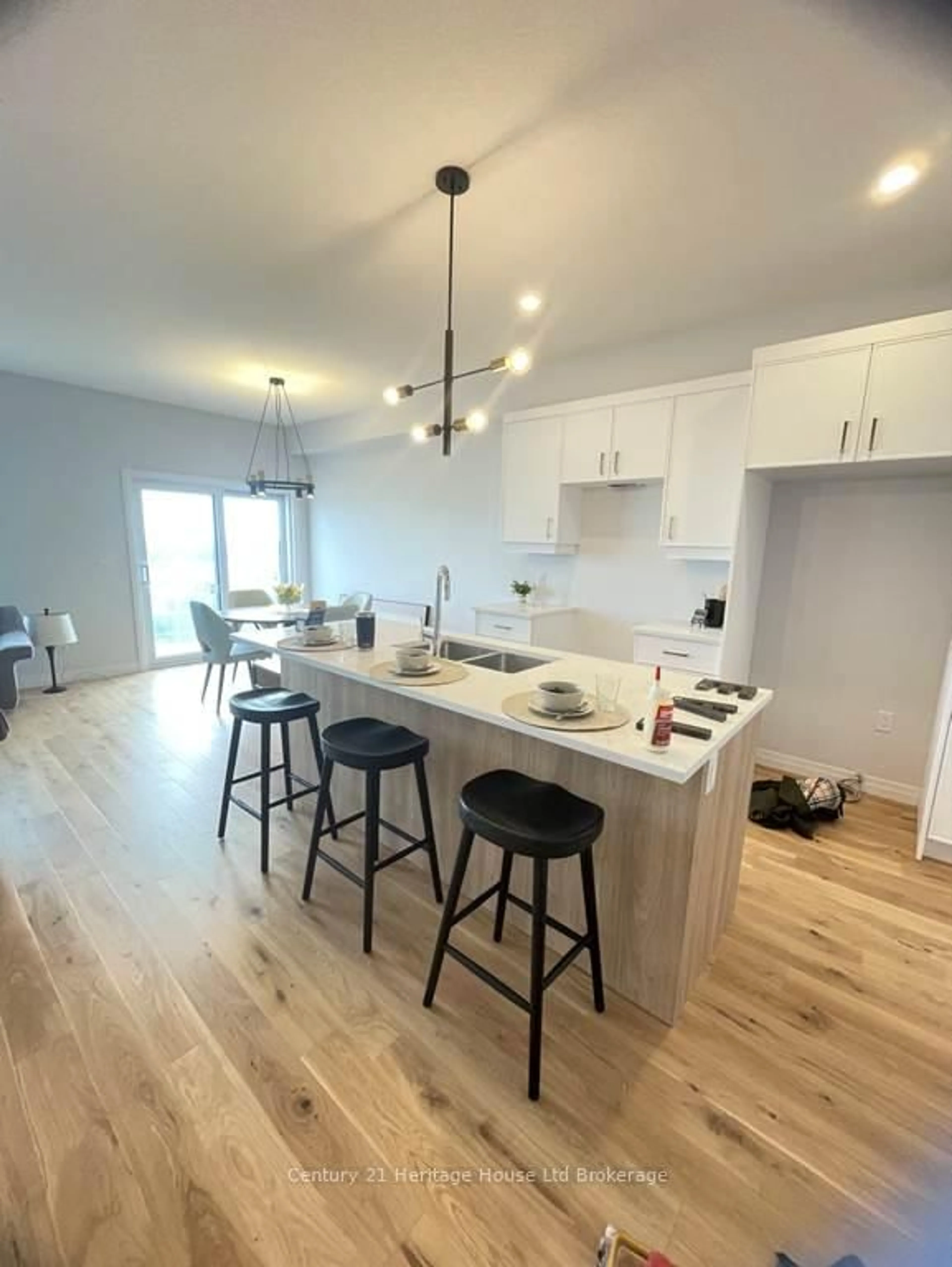 Open concept kitchen, wood/laminate floor for 317 Kading Cres, Woodstock Ontario N4S 0G6
