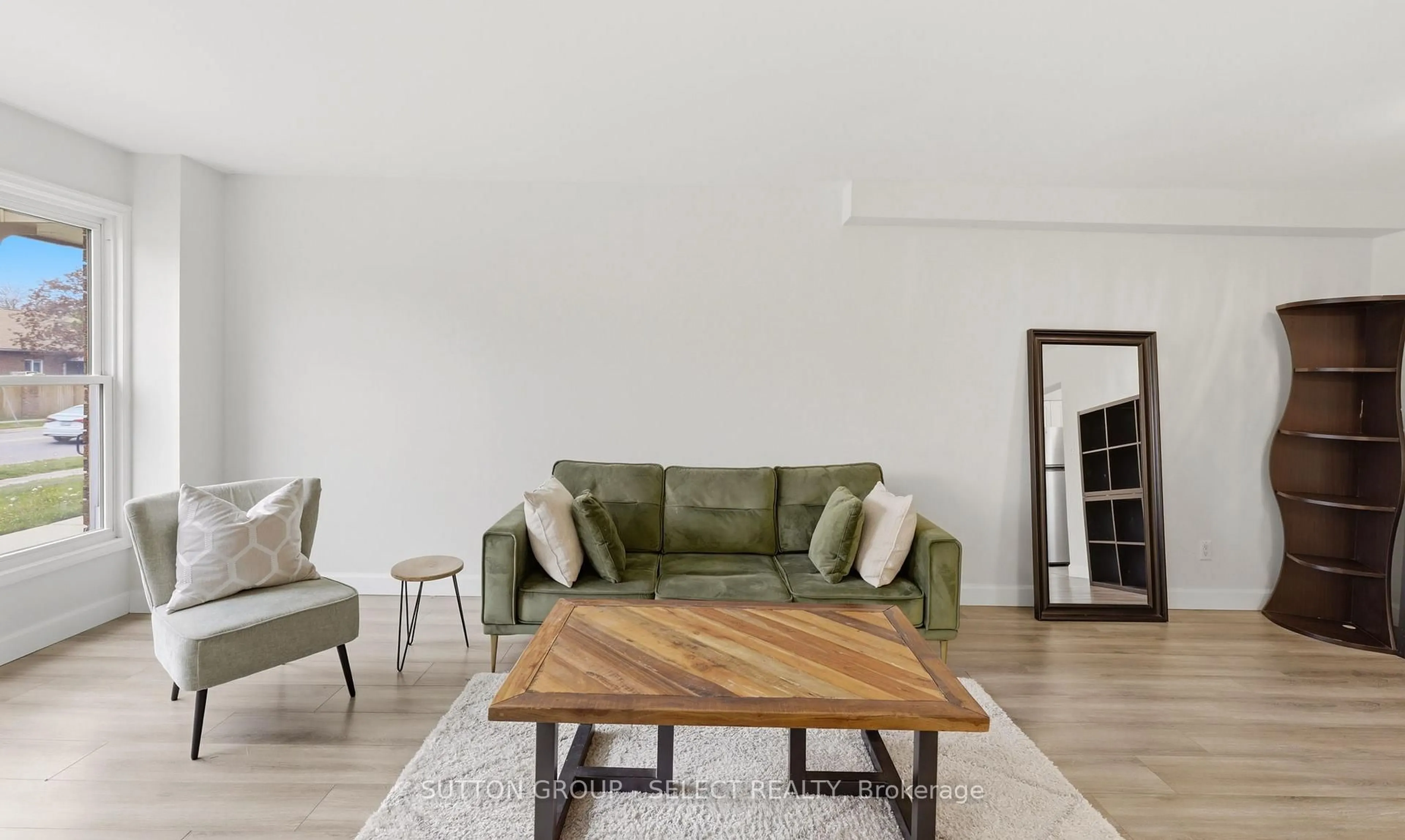 Living room with furniture, wood/laminate floor for 51 Sholto Dr #24, London South Ontario N6E 2H9