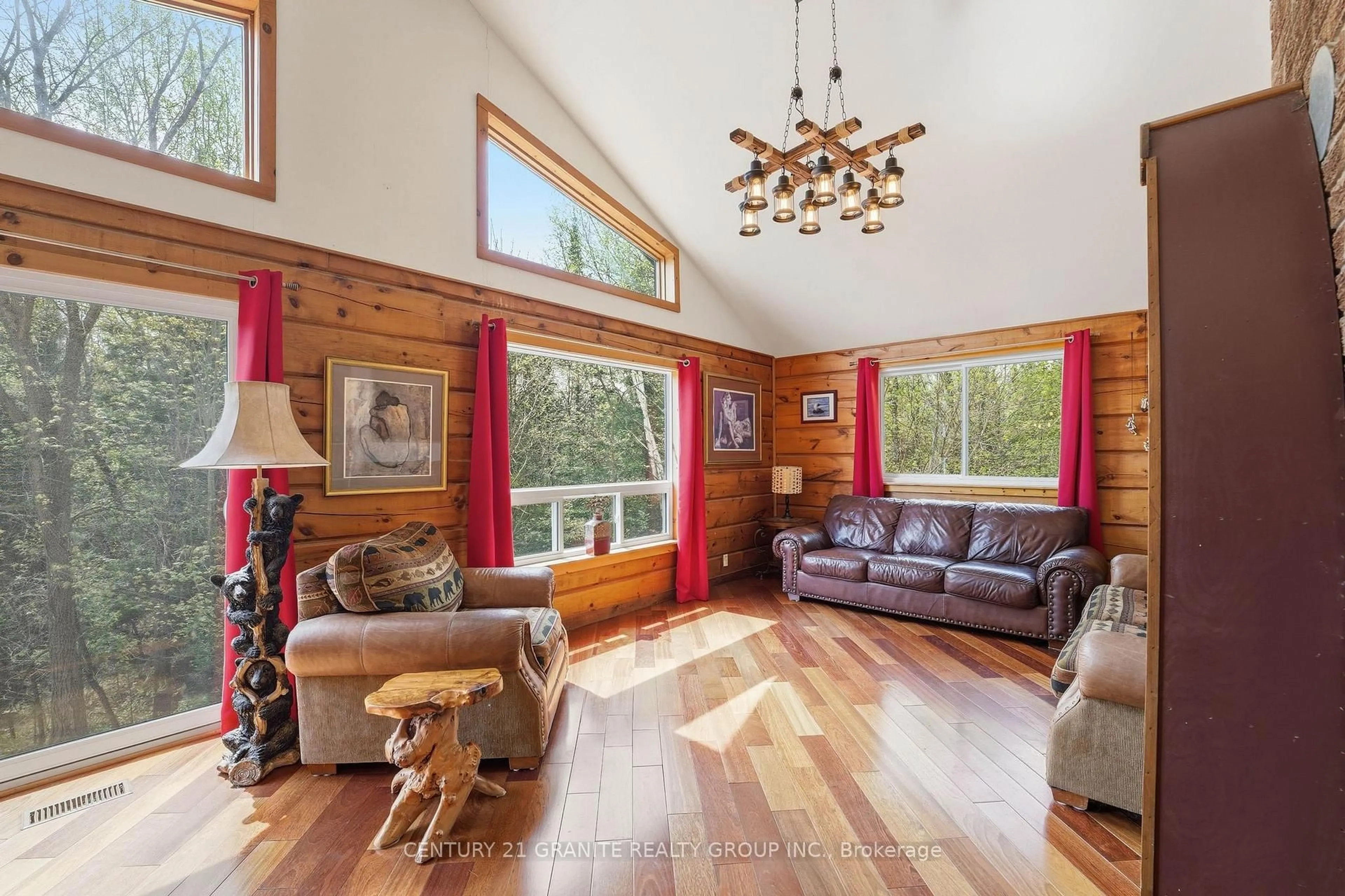 Living room with furniture, wood/laminate floor for 439 Rose Island Rd, Coe Hill Ontario K0L 1P0