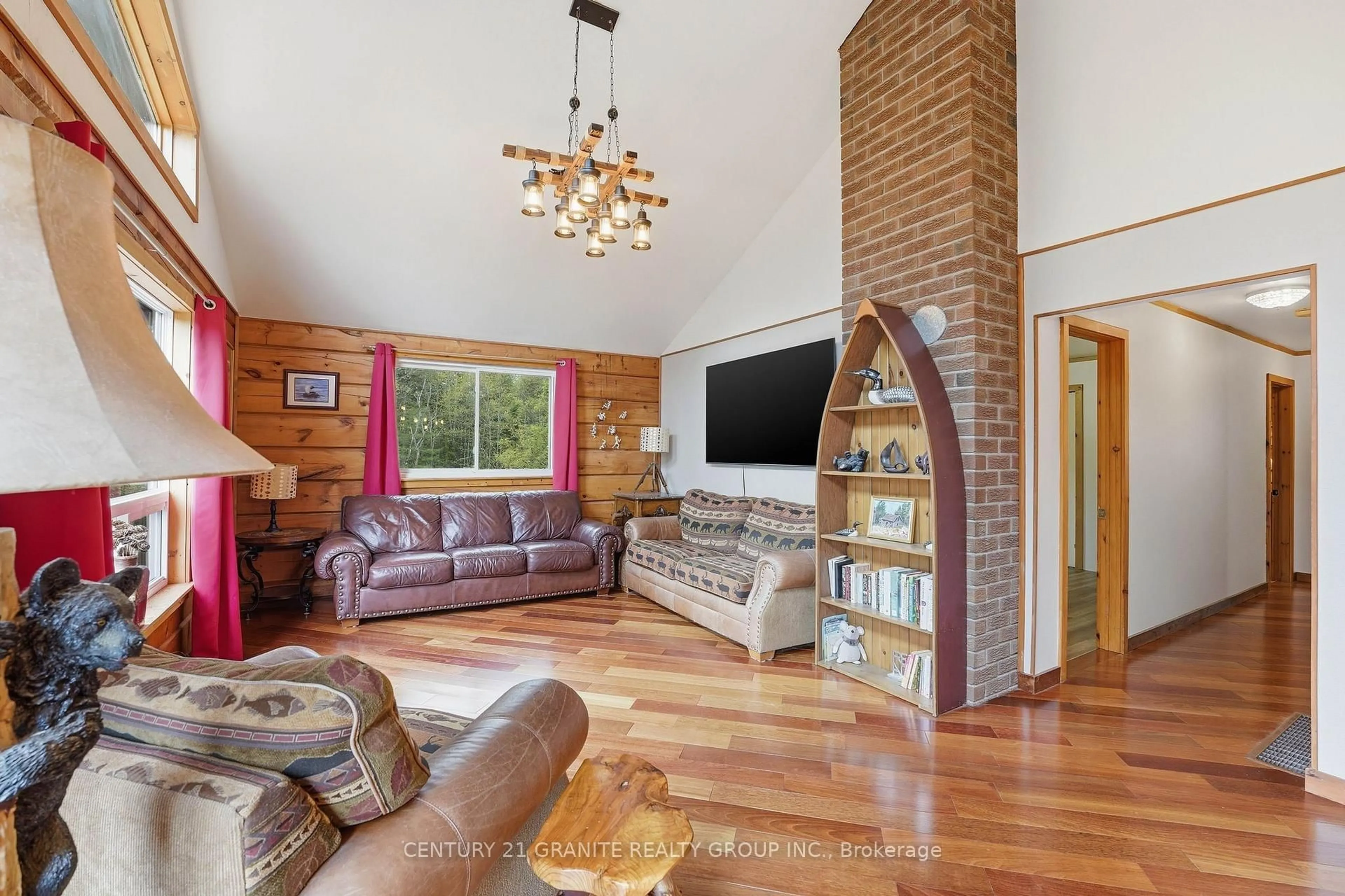 Living room with furniture, wood/laminate floor for 439 Rose Island Rd, Coe Hill Ontario K0L 1P0