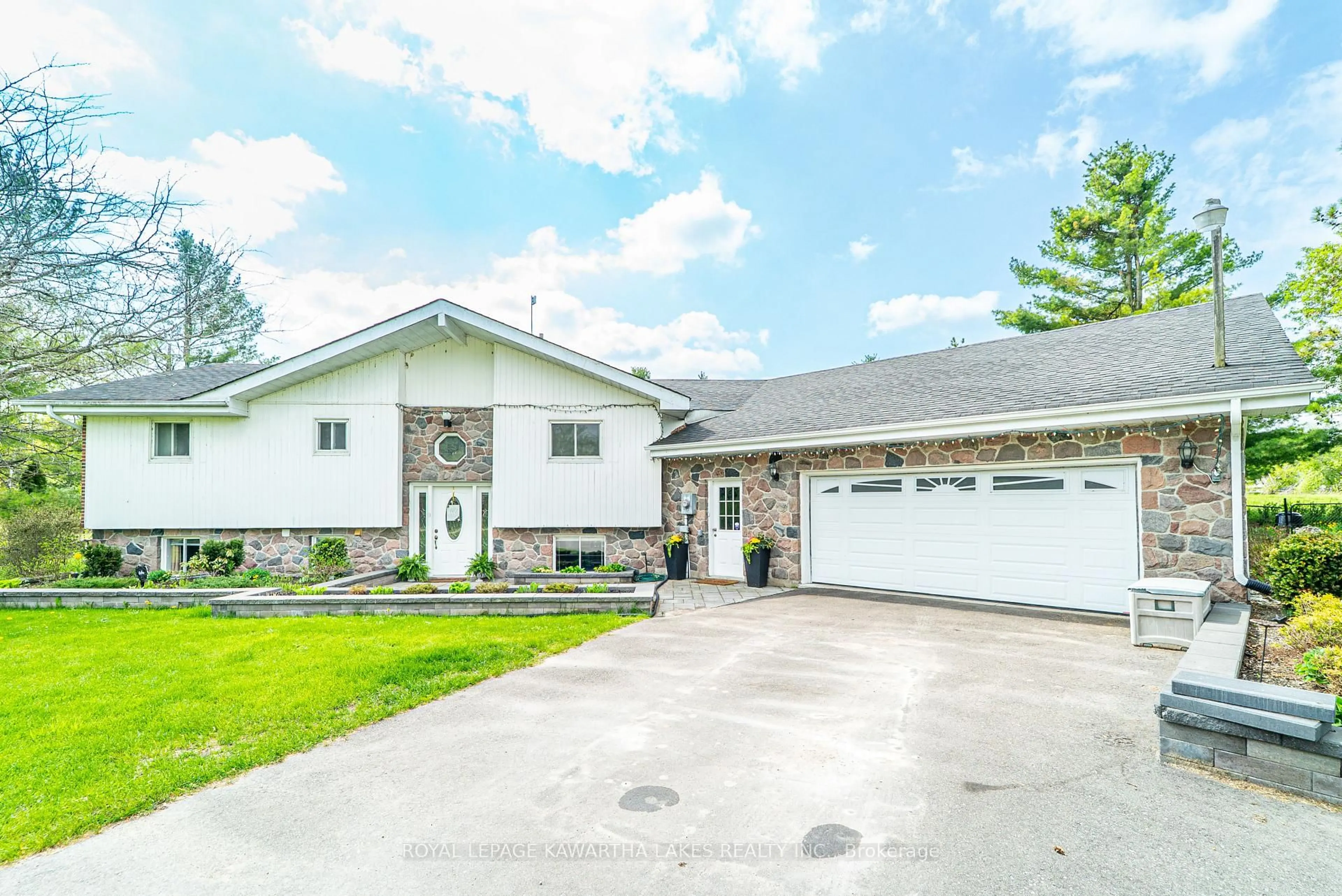 Home with vinyl exterior material, street for 1032 Zion Rd, Kawartha Lakes Ontario K0M 2C0