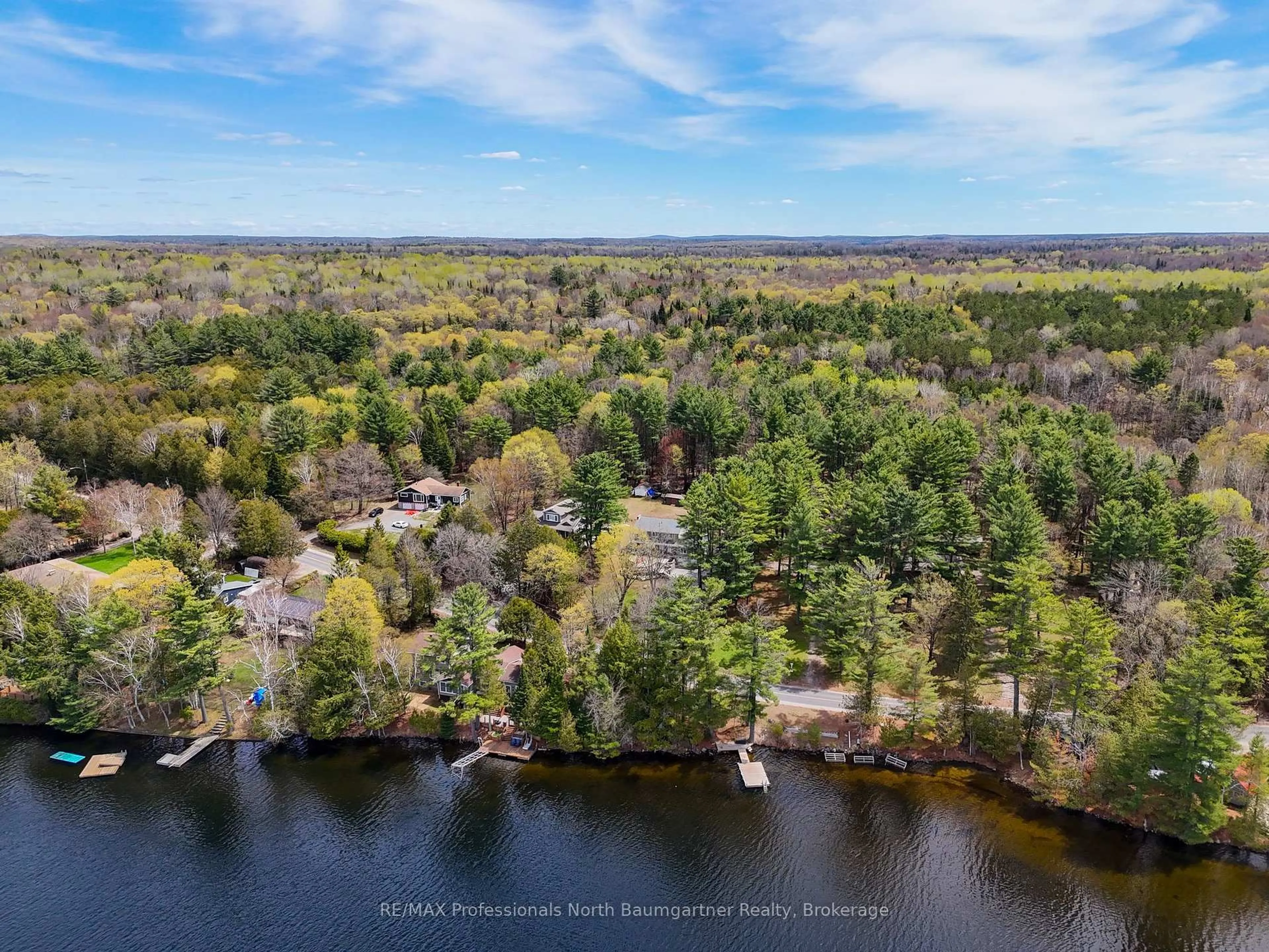 A pic from outside/outdoor area/front of a property/back of a property/a pic from drone, water/lake/river/ocean view for 1506 Kashagawigamog Lake Rd, Minden Hills Ontario K0M 2K0