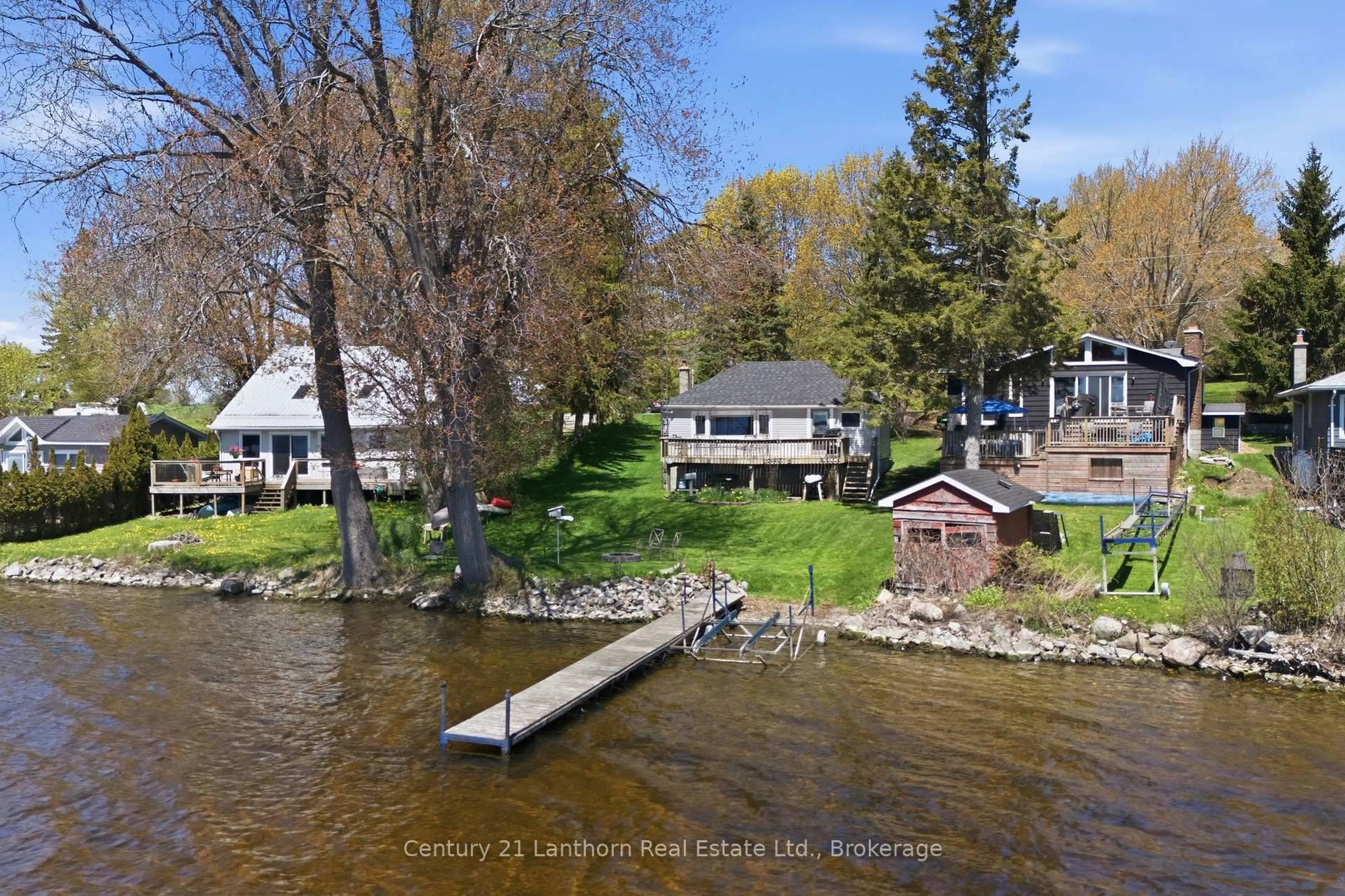 A pic from outside/outdoor area/front of a property/back of a property/a pic from drone, water/lake/river/ocean view for 1051 Lakeside Dr, Prince Edward County Ontario K0K 1T0