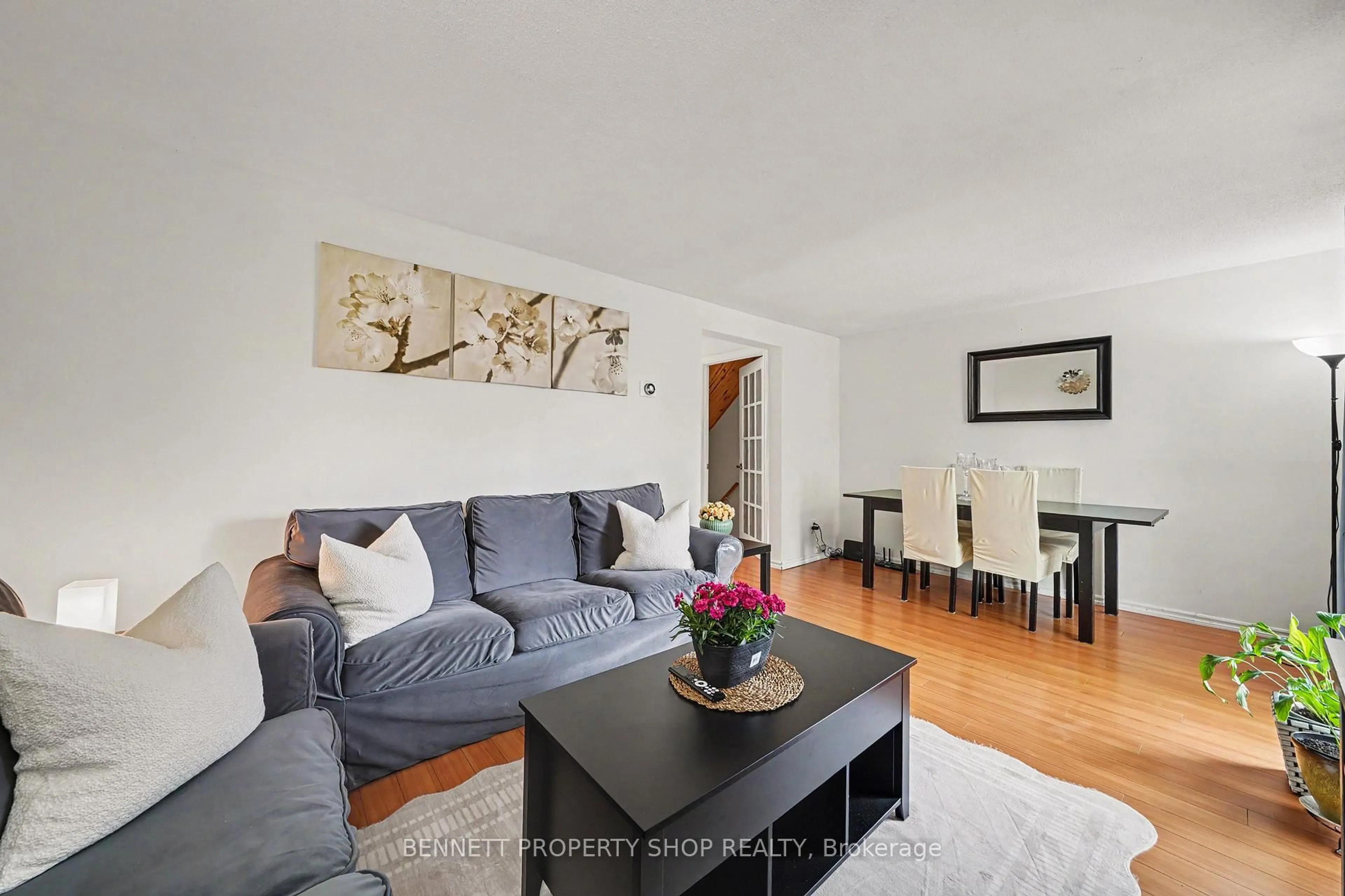 Living room with furniture, wood/laminate floor for 1045 Morrison Dr #186, Ottawa Ontario K2H 7L2