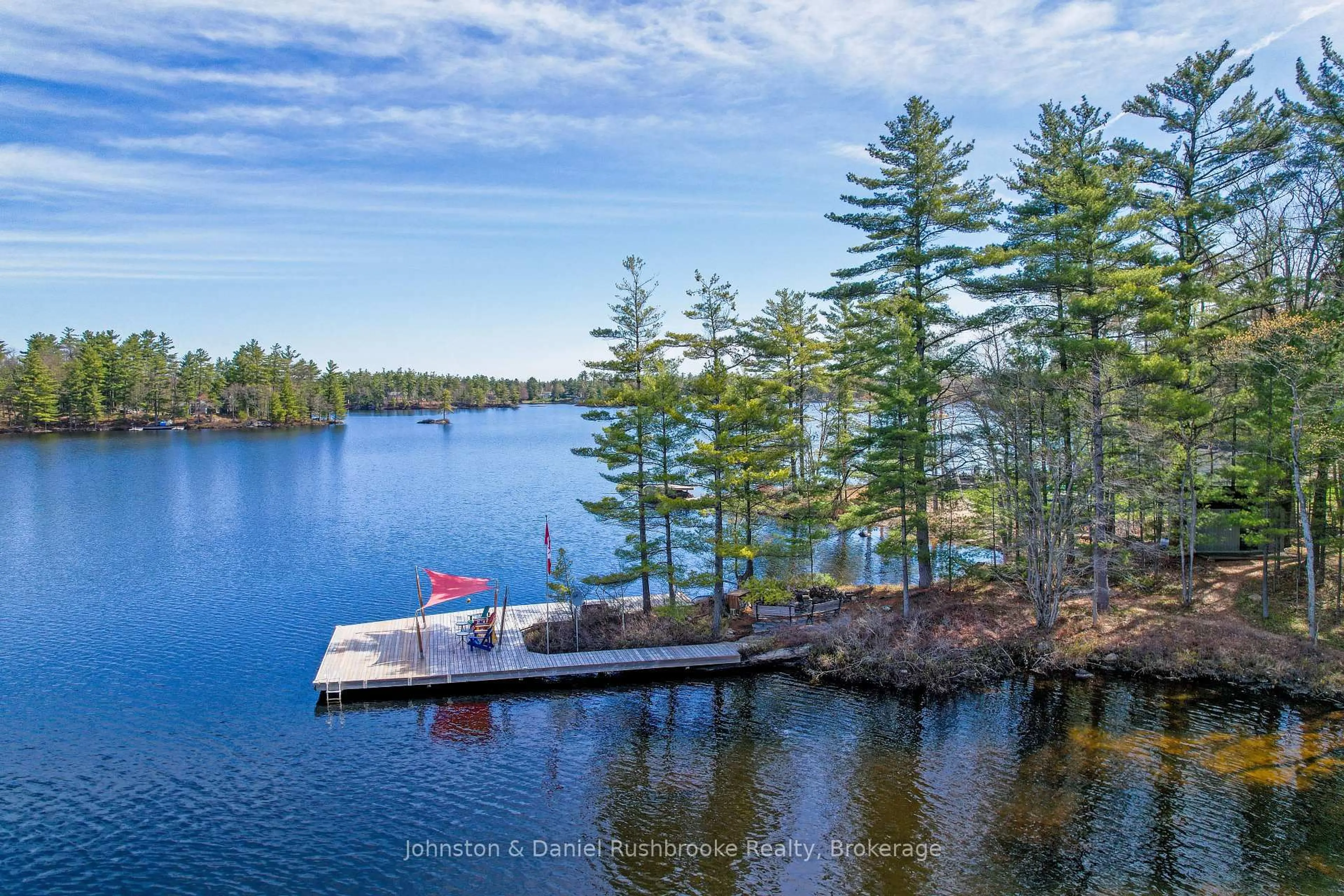A pic from outside/outdoor area/front of a property/back of a property/a pic from drone, water/lake/river/ocean view for 1150 Road 1000, Gravenhurst Ontario P1P 0E7
