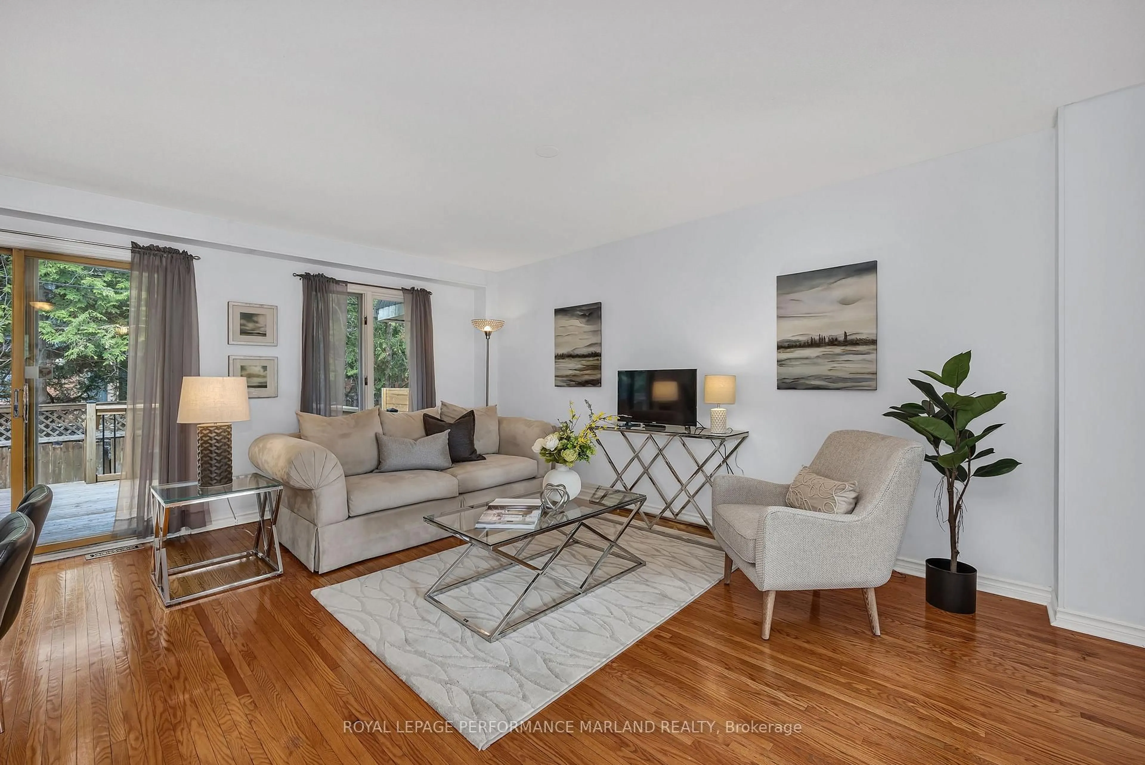 Living room with furniture, wood/laminate floor for 9 Marco Lane, Ottawa Ontario K1S 5A1