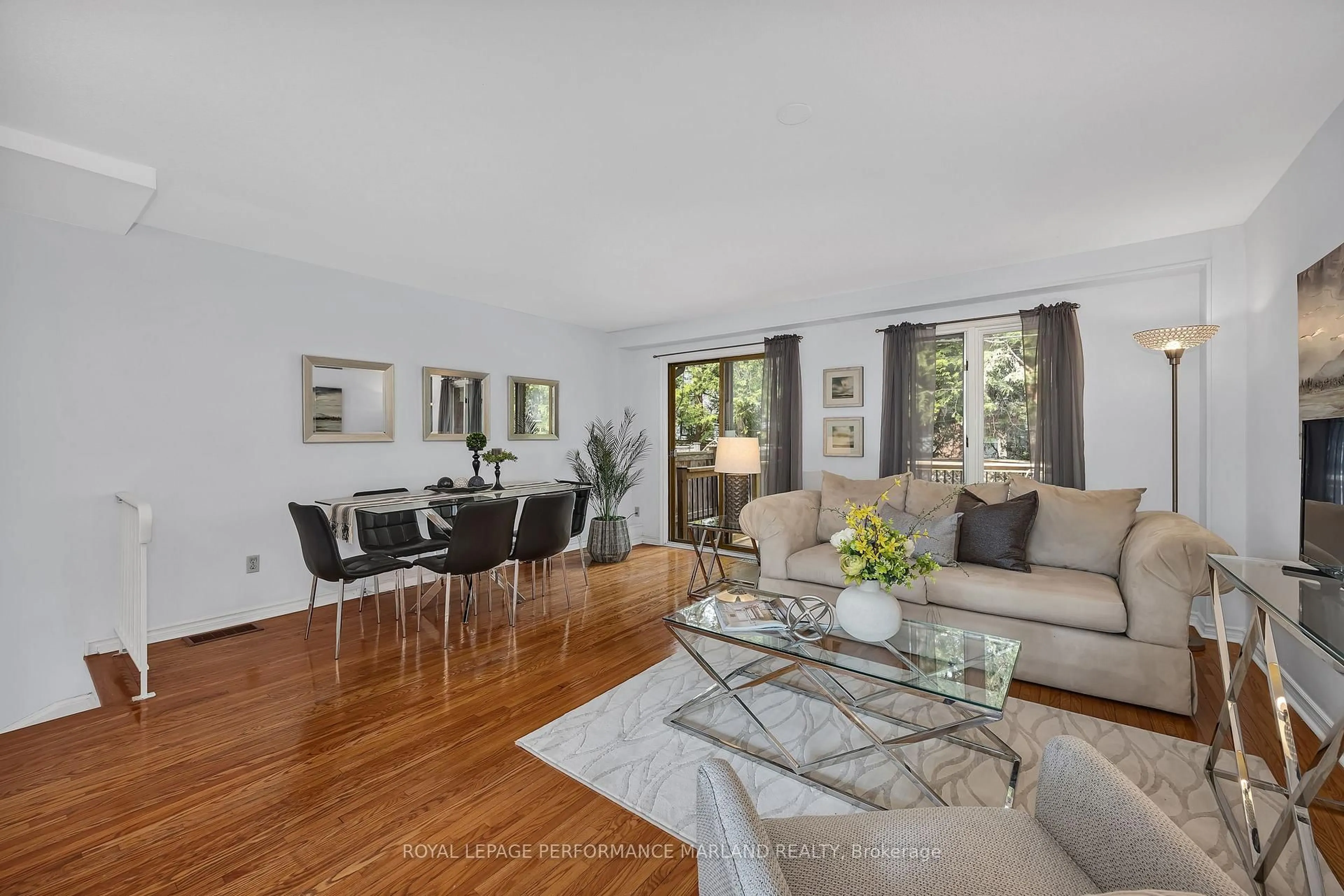 Living room with furniture, wood/laminate floor for 9 Marco Lane, Ottawa Ontario K1S 5A1