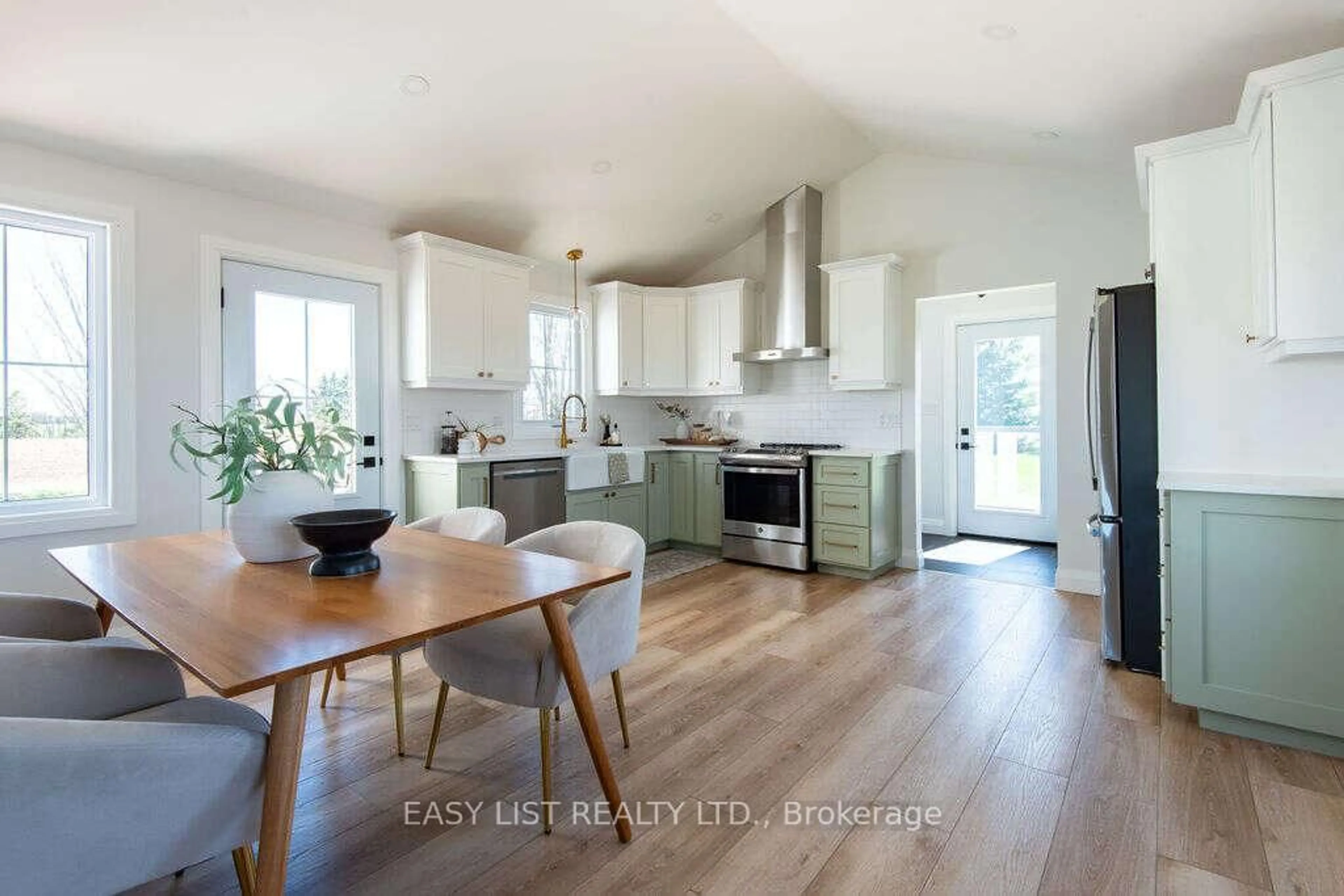Open concept kitchen, wood/laminate floor for 8993 Petrolia Line, Brooke-Alvinston Ontario N0N 1A0