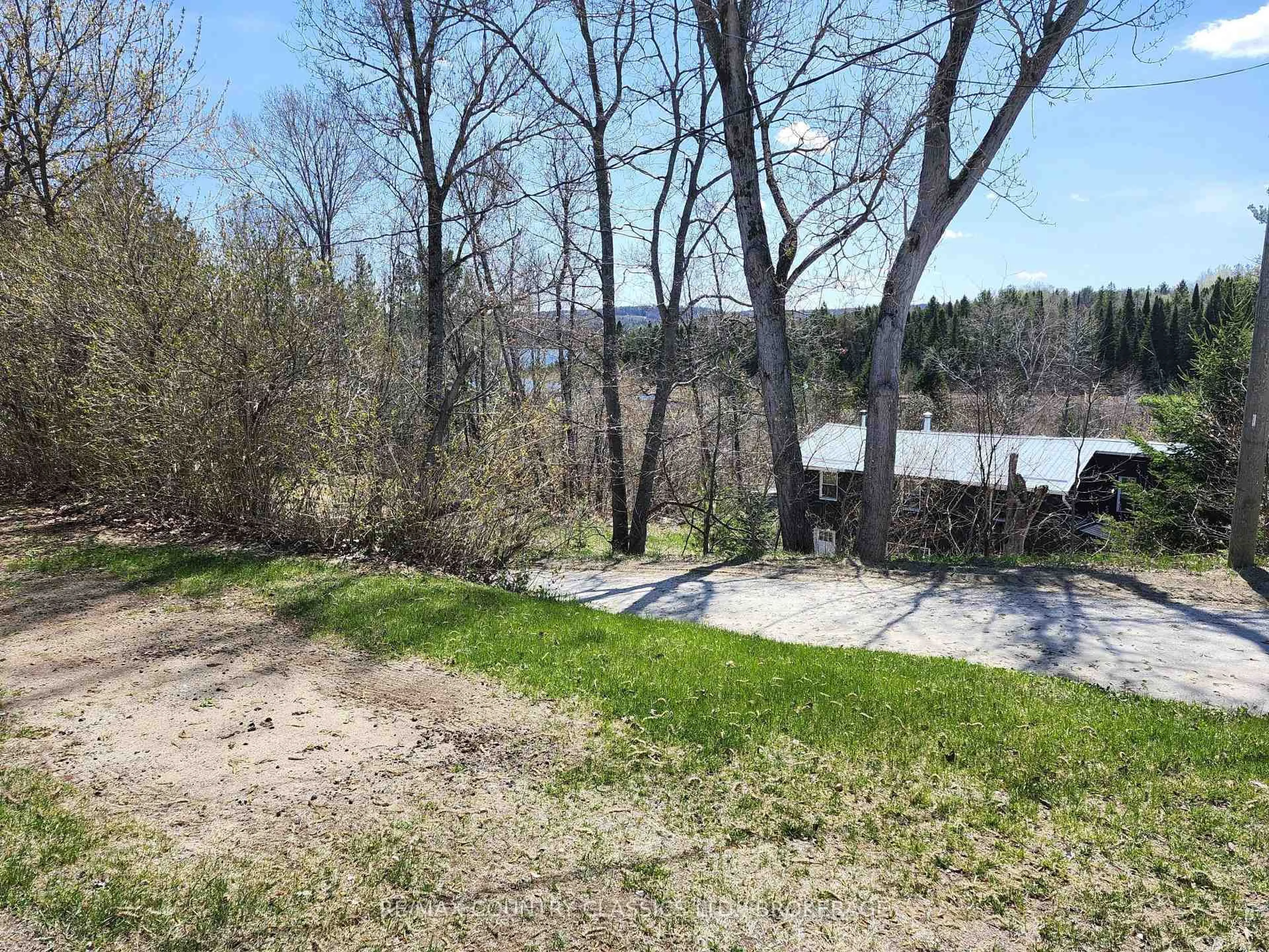 A pic from outside/outdoor area/front of a property/back of a property/a pic from drone, water/lake/river/ocean view for 11 Central St, Denbigh Ontario K0H 1L0