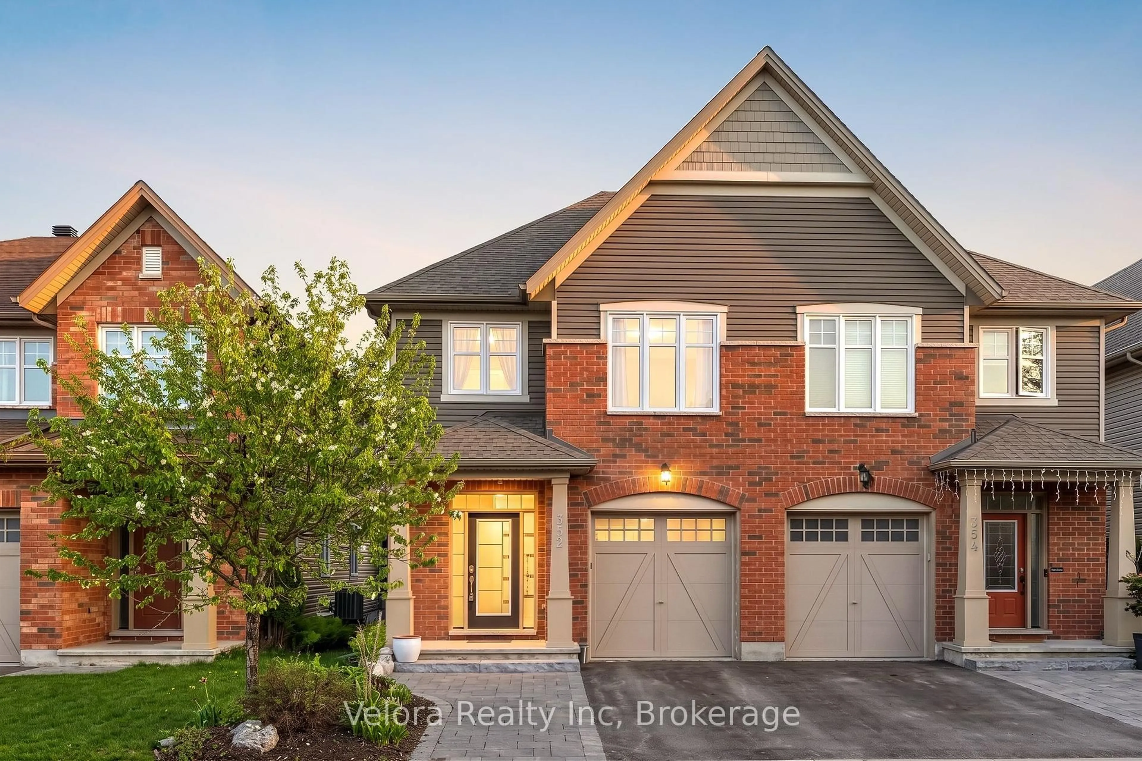 Home with brick exterior material, street for 352 Warmstone Dr, Ottawa Ontario K2S 0W3