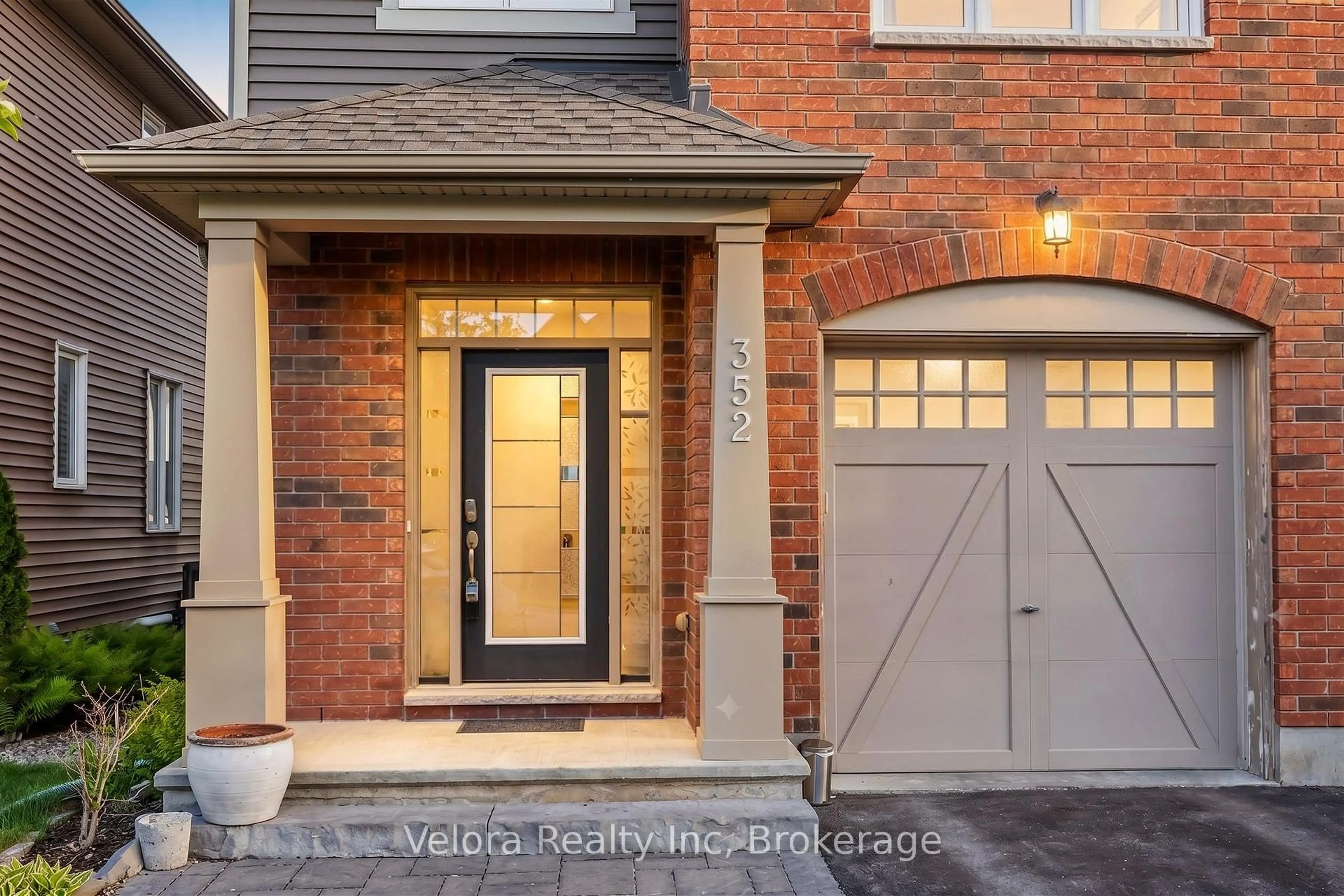 Home with brick exterior material, street for 352 Warmstone Dr, Ottawa Ontario K2S 0W3