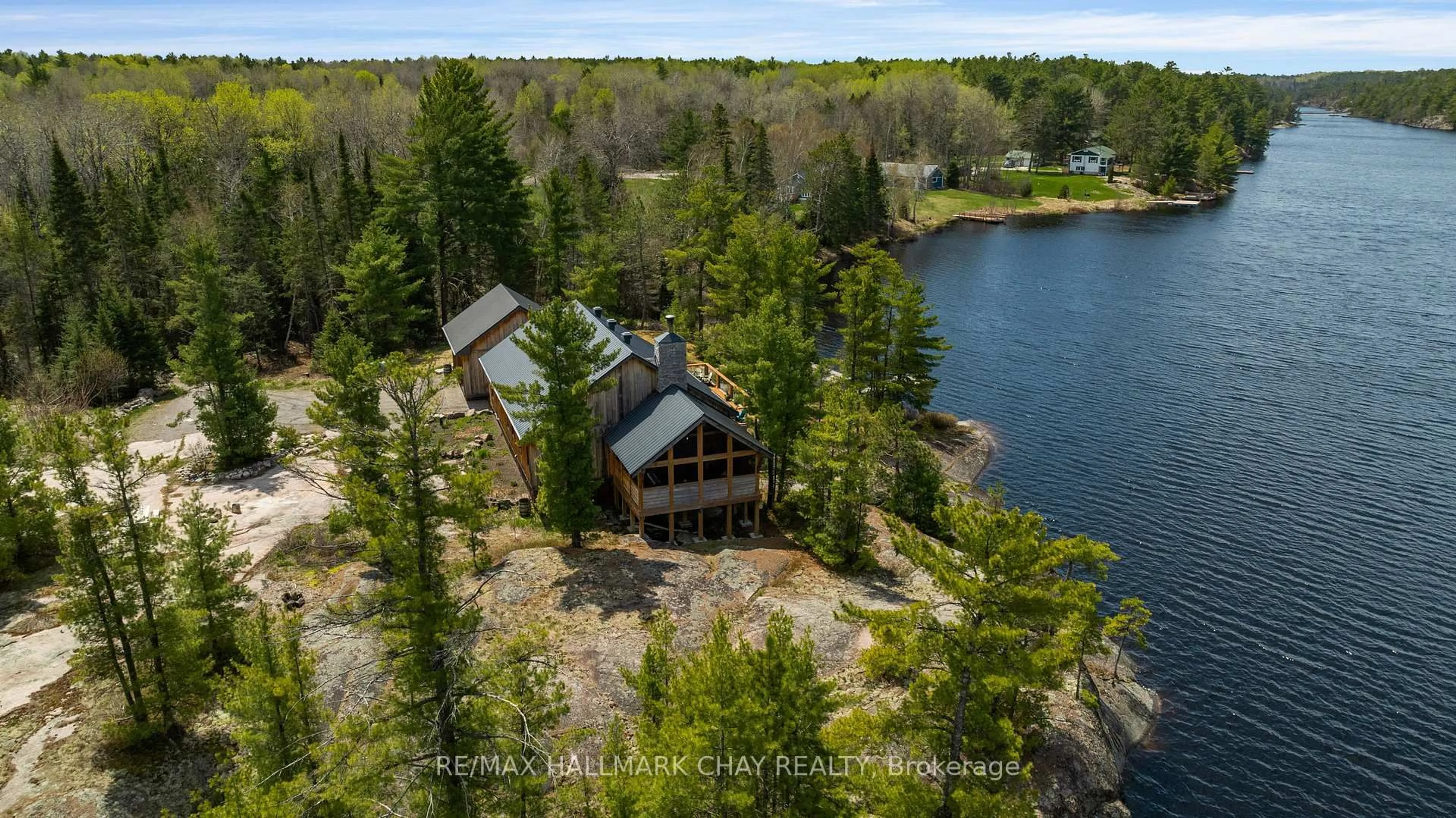 A pic from outside/outdoor area/front of a property/back of a property/a pic from drone, water/lake/river/ocean view for 164 Perch Lake Rd, West Nipissing Ontario P0M 2K0