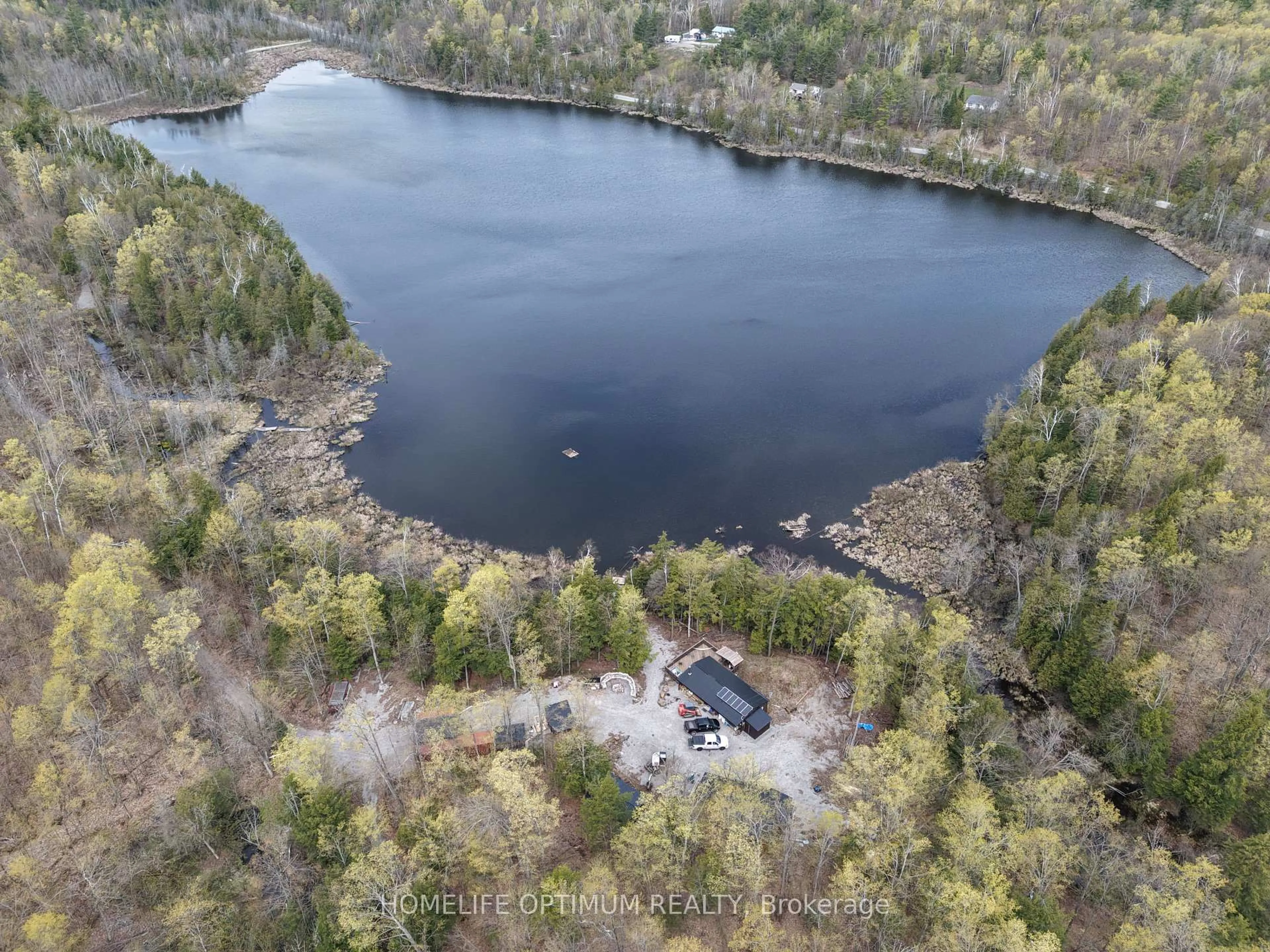 A pic from outside/outdoor area/front of a property/back of a property/a pic from drone, water/lake/river/ocean view for 1086 Crystal Lake Rd, Trent Lakes Ontario K0M 2A0