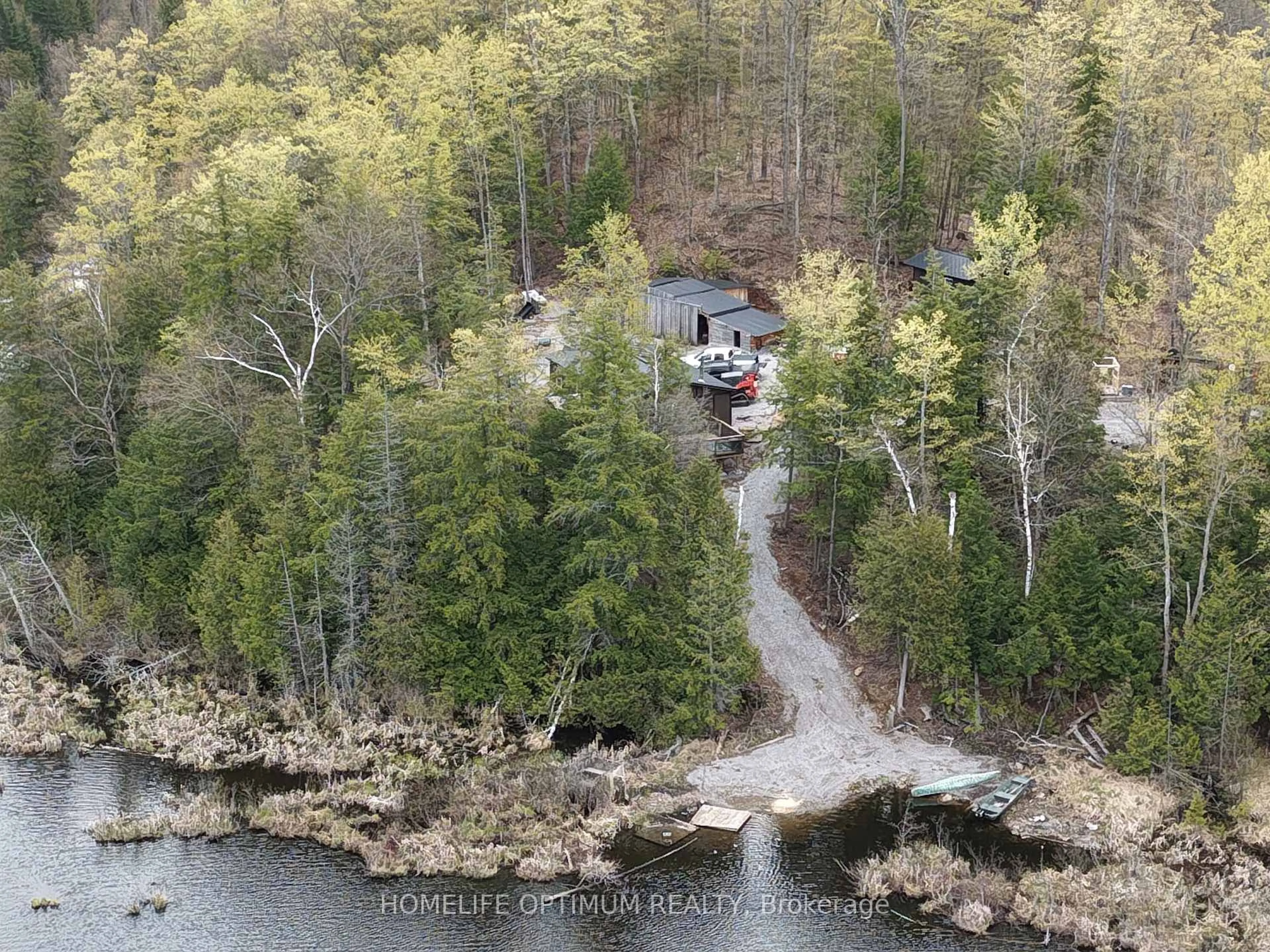 A pic from outside/outdoor area/front of a property/back of a property/a pic from drone, water/lake/river/ocean view for 1086 Crystal Lake Rd, Trent Lakes Ontario K0M 2A0