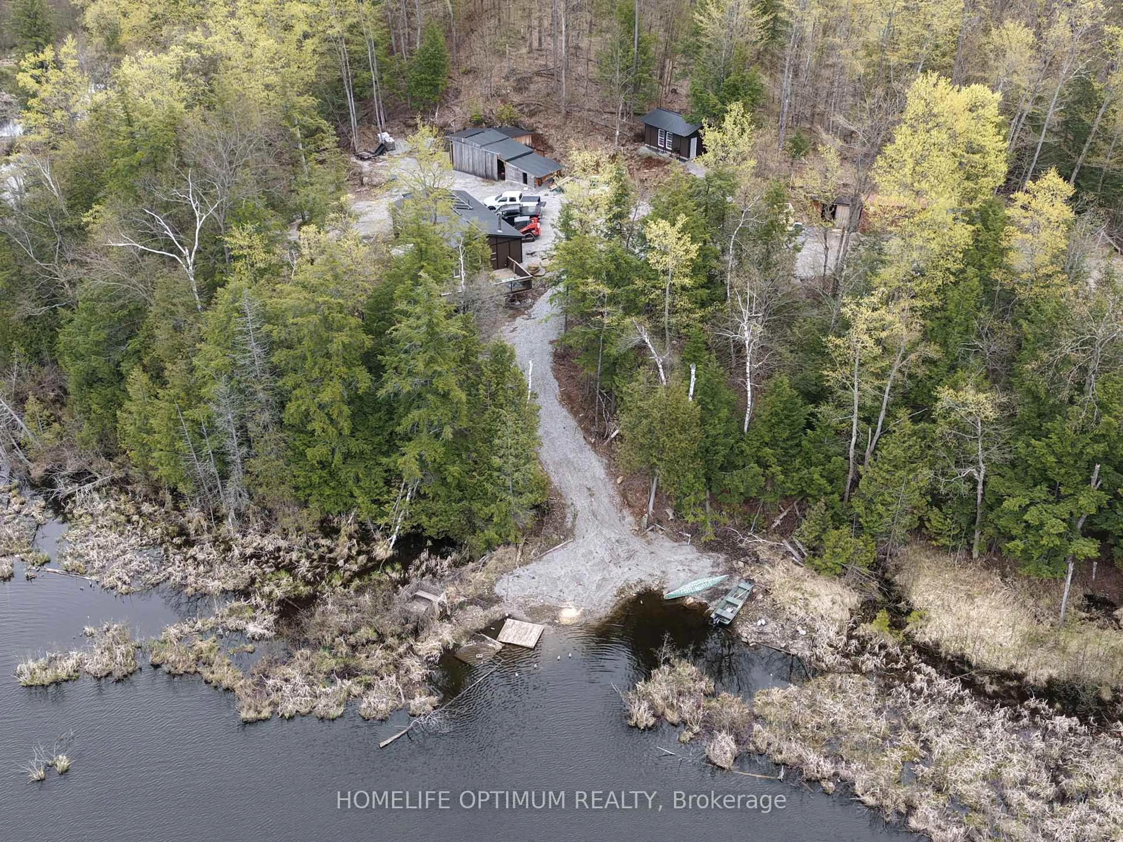 A pic from outside/outdoor area/front of a property/back of a property/a pic from drone, water/lake/river/ocean view for 1086 Crystal Lake Rd, Trent Lakes Ontario K0M 2A0