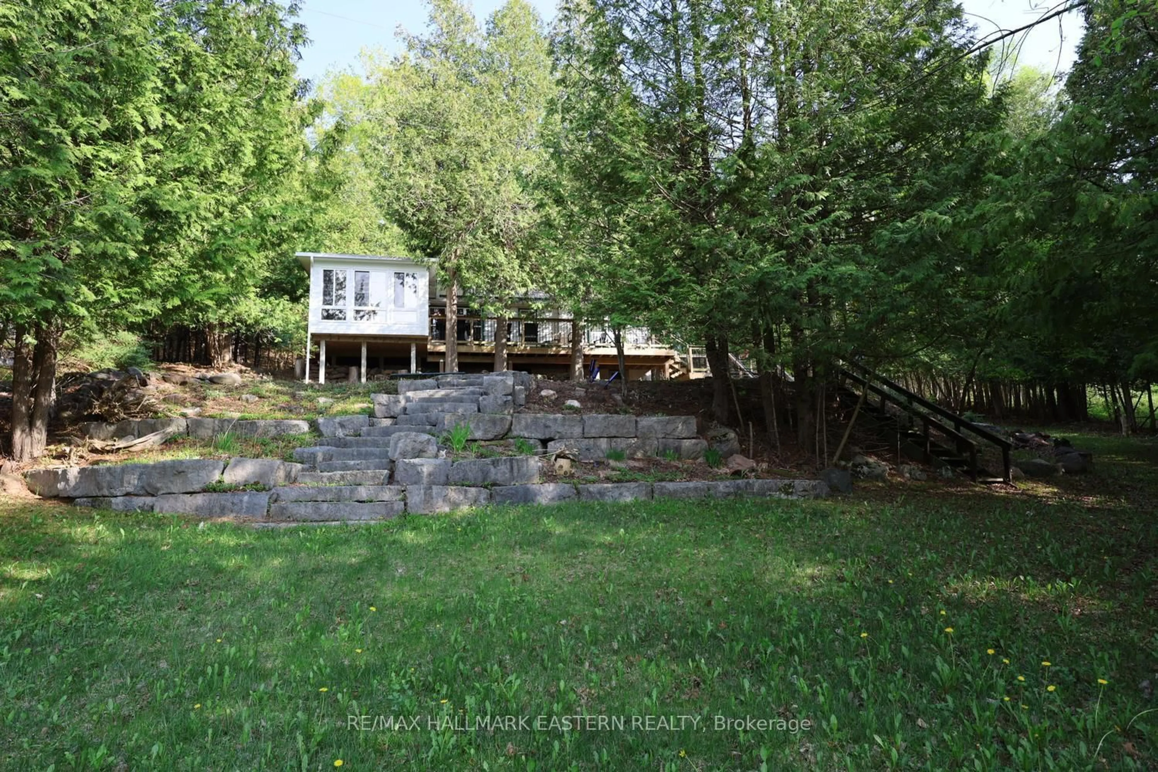 A pic from outside/outdoor area/front of a property/back of a property/a pic from drone, forest/trees view for 348 Round Lake Rd, Havelock-Belmont-Methuen Ontario K0L 1Z0