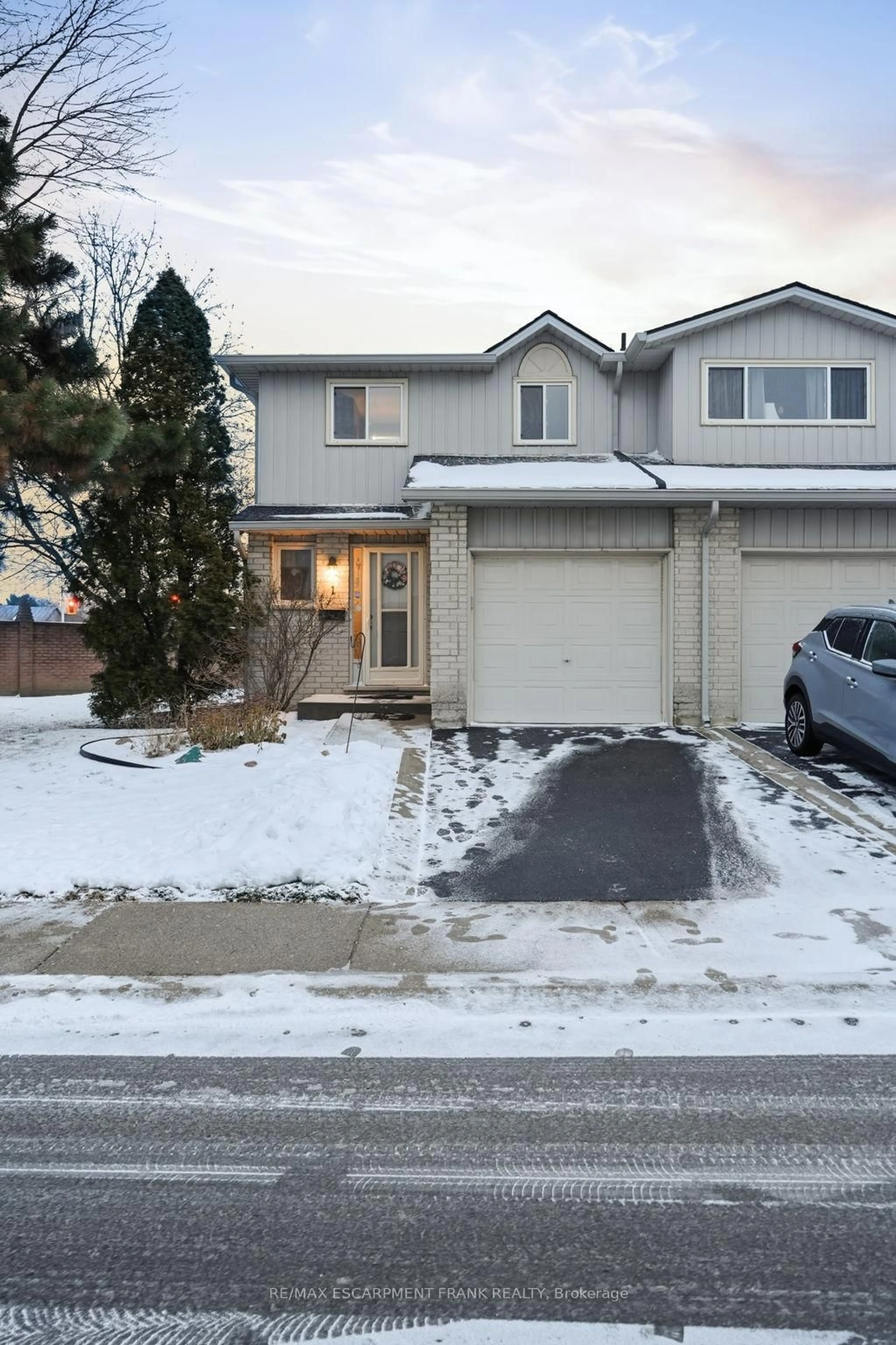 Home with vinyl exterior material, street for 1675 Upper Gage Ave #1, Hamilton Ontario L8W 3R7