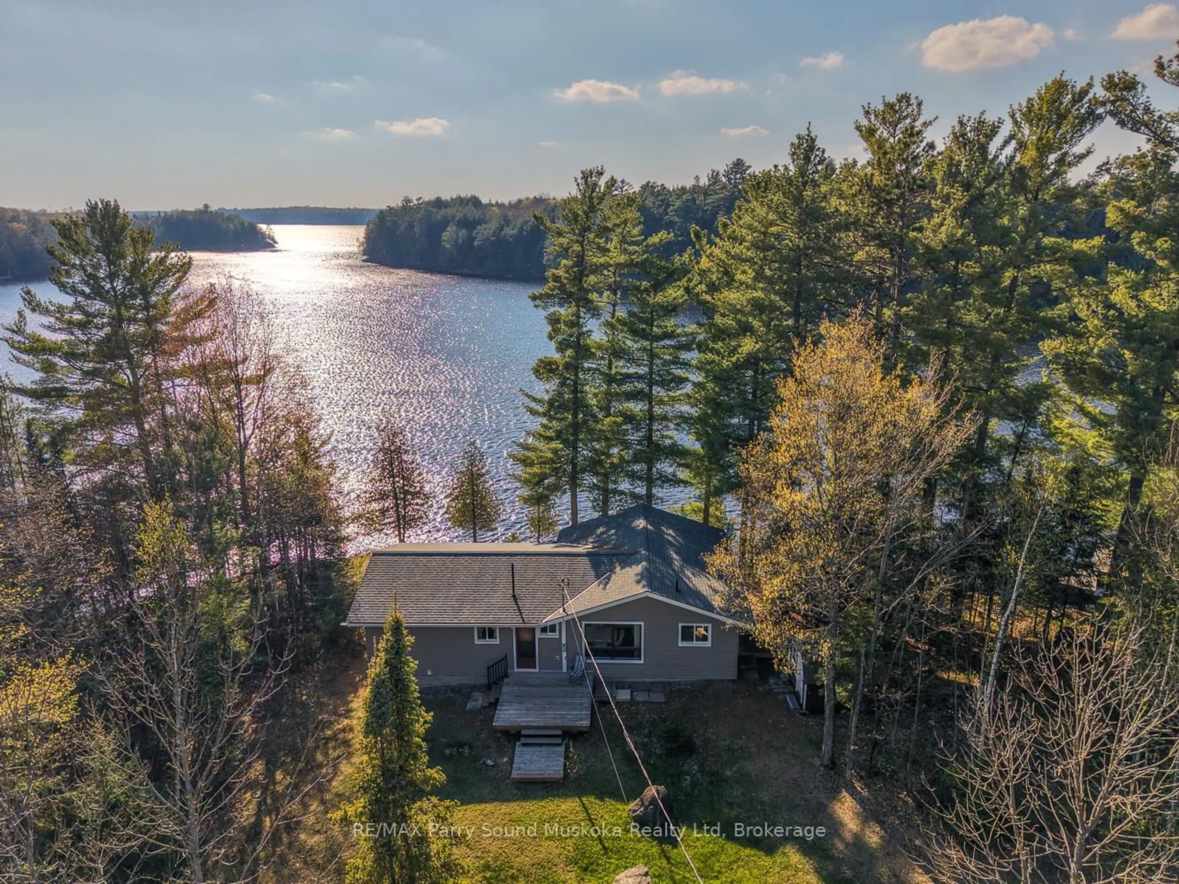A pic from outside/outdoor area/front of a property/back of a property/a pic from drone, water/lake/river/ocean view for 37 Smithpine Cres, McKellar Ontario P2A 0B5