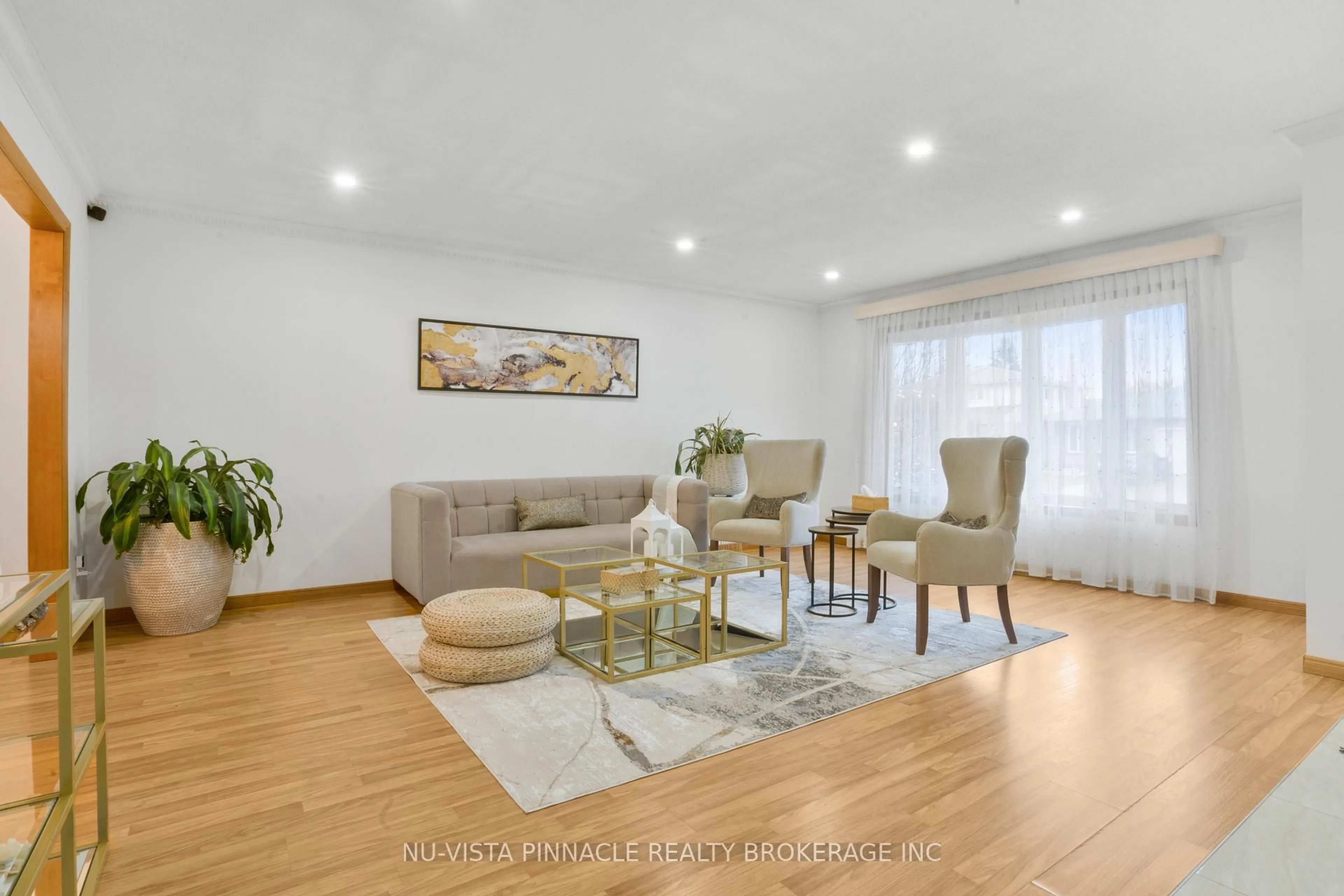 Living room with furniture, wood/laminate floor for 44 Golfdale Cres, London South Ontario N6C 5P2