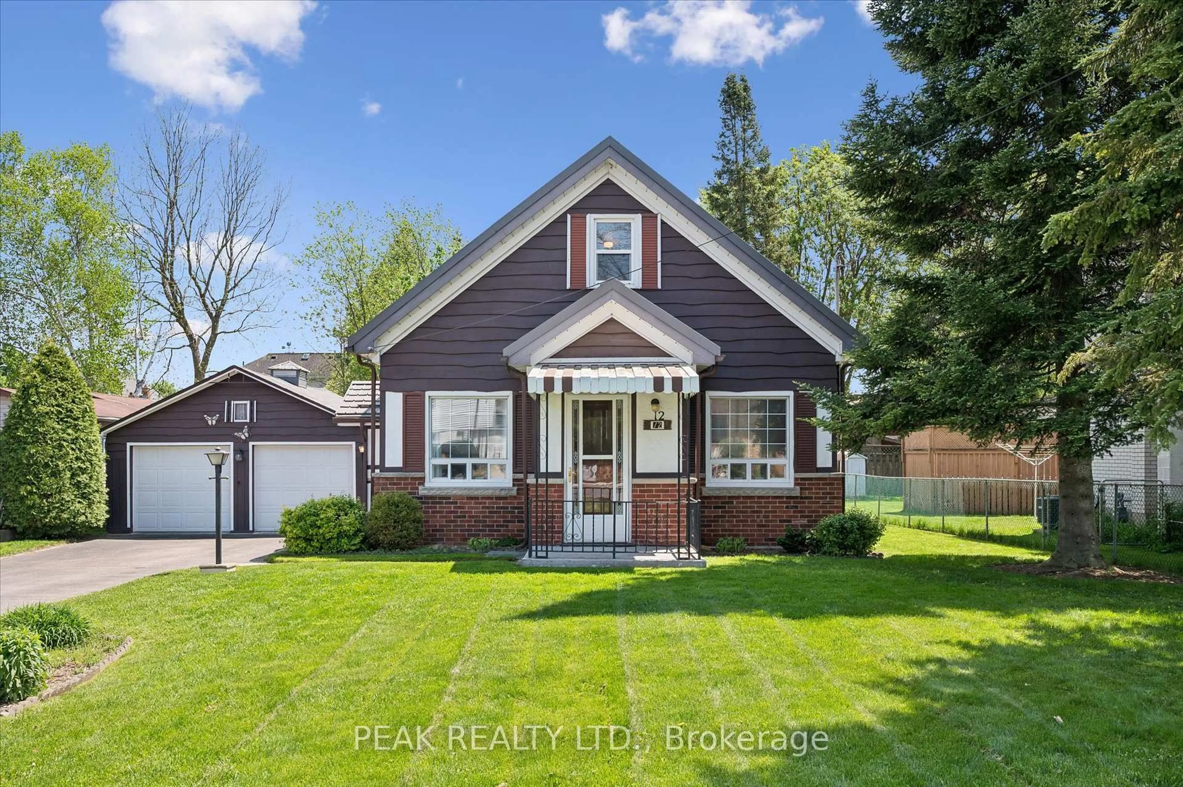 Home with brick exterior material, street for 12 Market St, Kitchener Ontario N2K 1H2