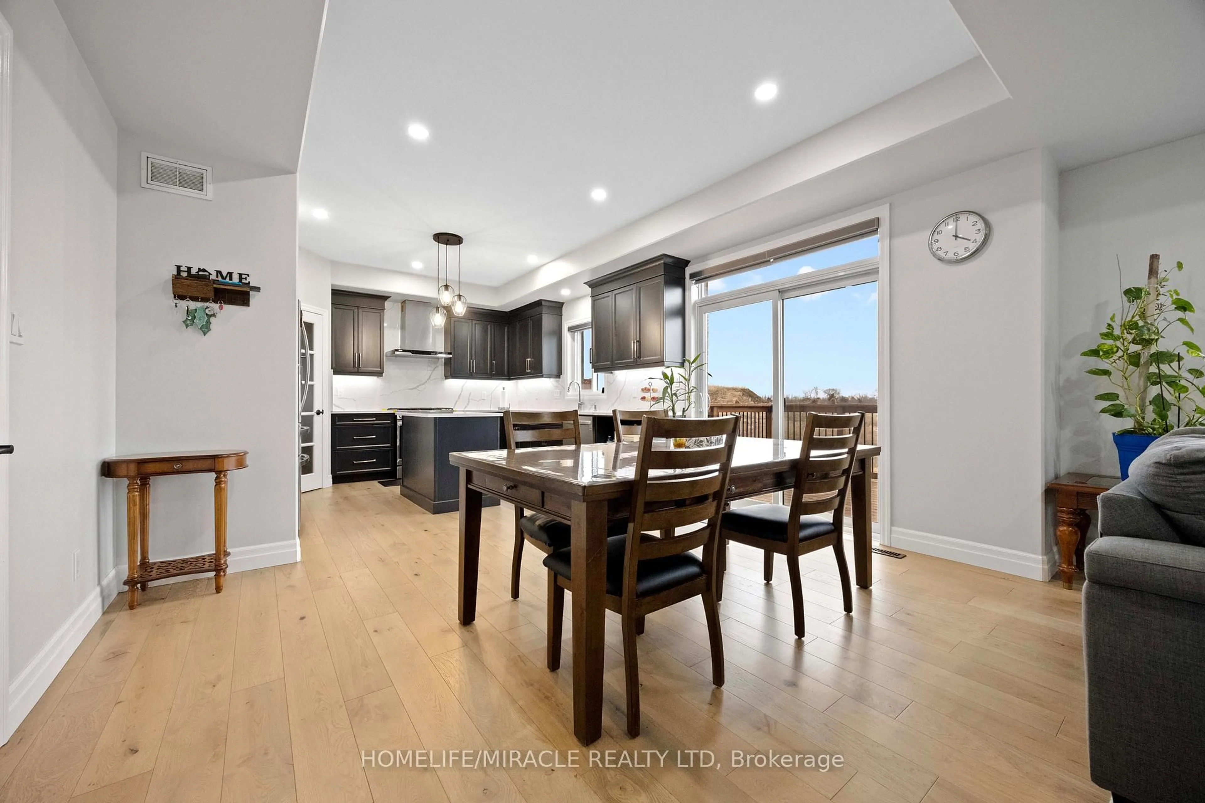 Open concept kitchen, wood/laminate floor for 61 Raycroft Dr, Belleville Ontario K8N 0R5