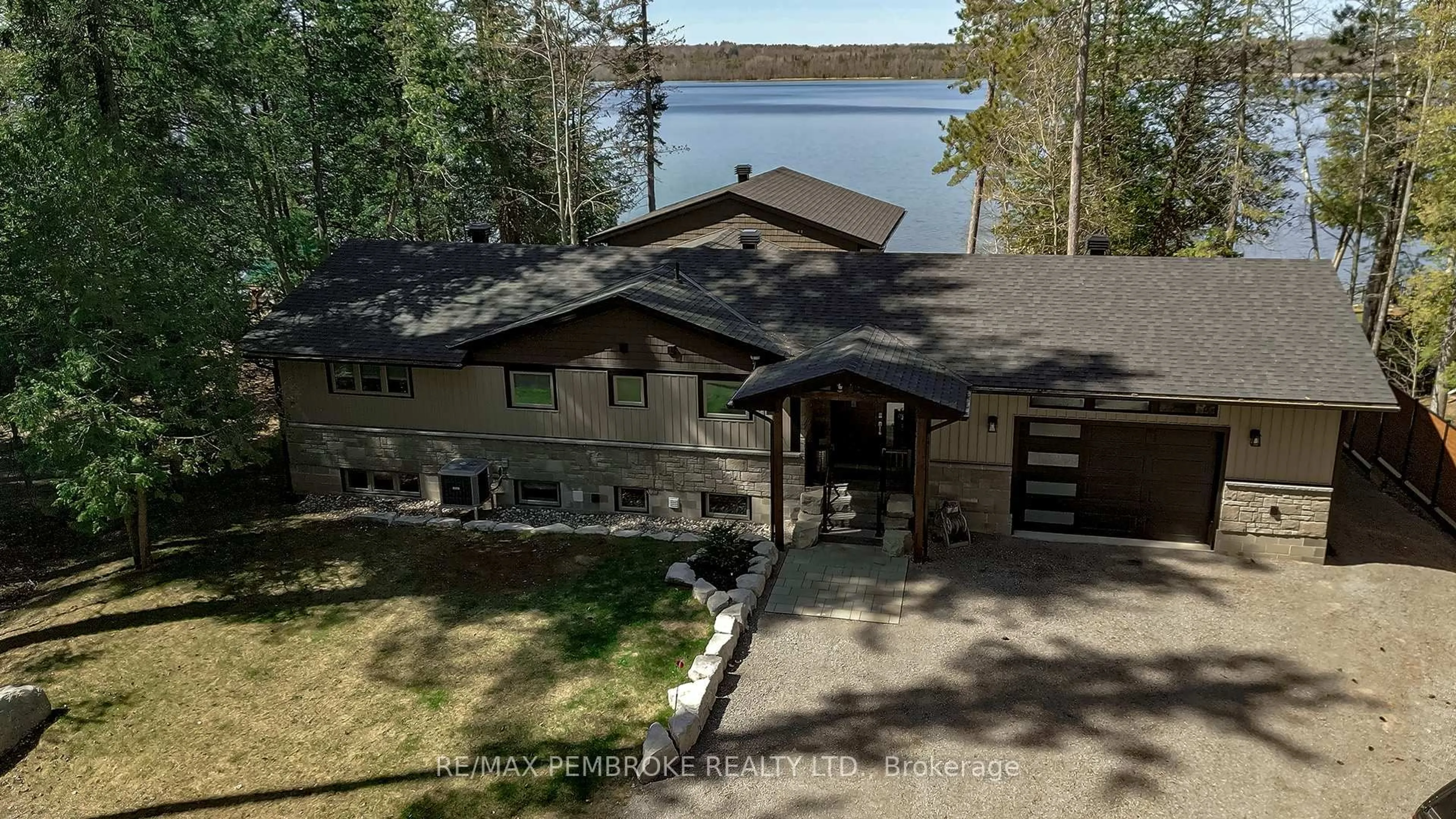 A pic from outside/outdoor area/front of a property/back of a property/a pic from drone, water/lake/river/ocean view for 299 Holiday Lane, Eganville Ontario K0J 1T0