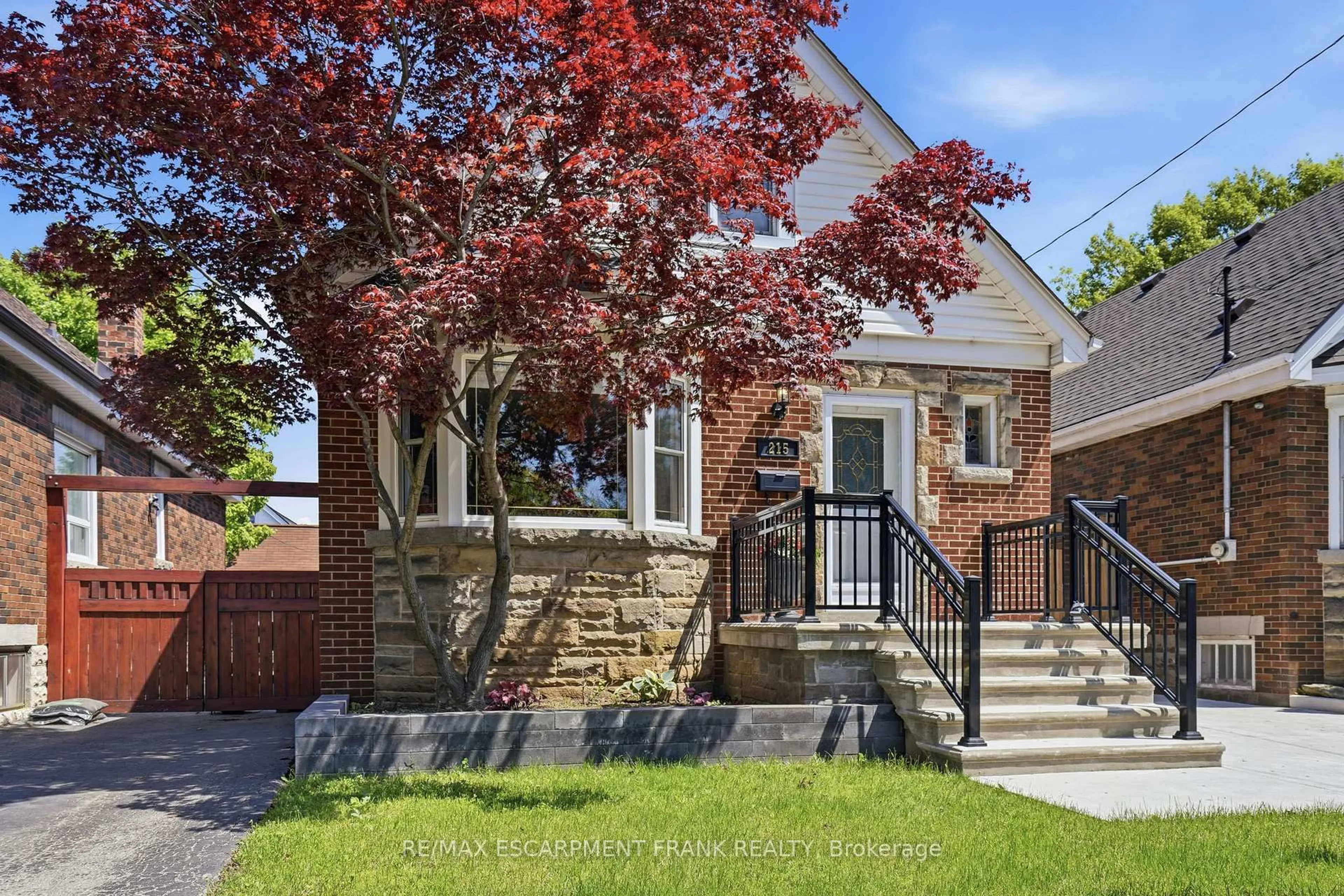 Home with brick exterior material, street for 215 Wexford Ave, Hamilton Ontario L8K 2P1