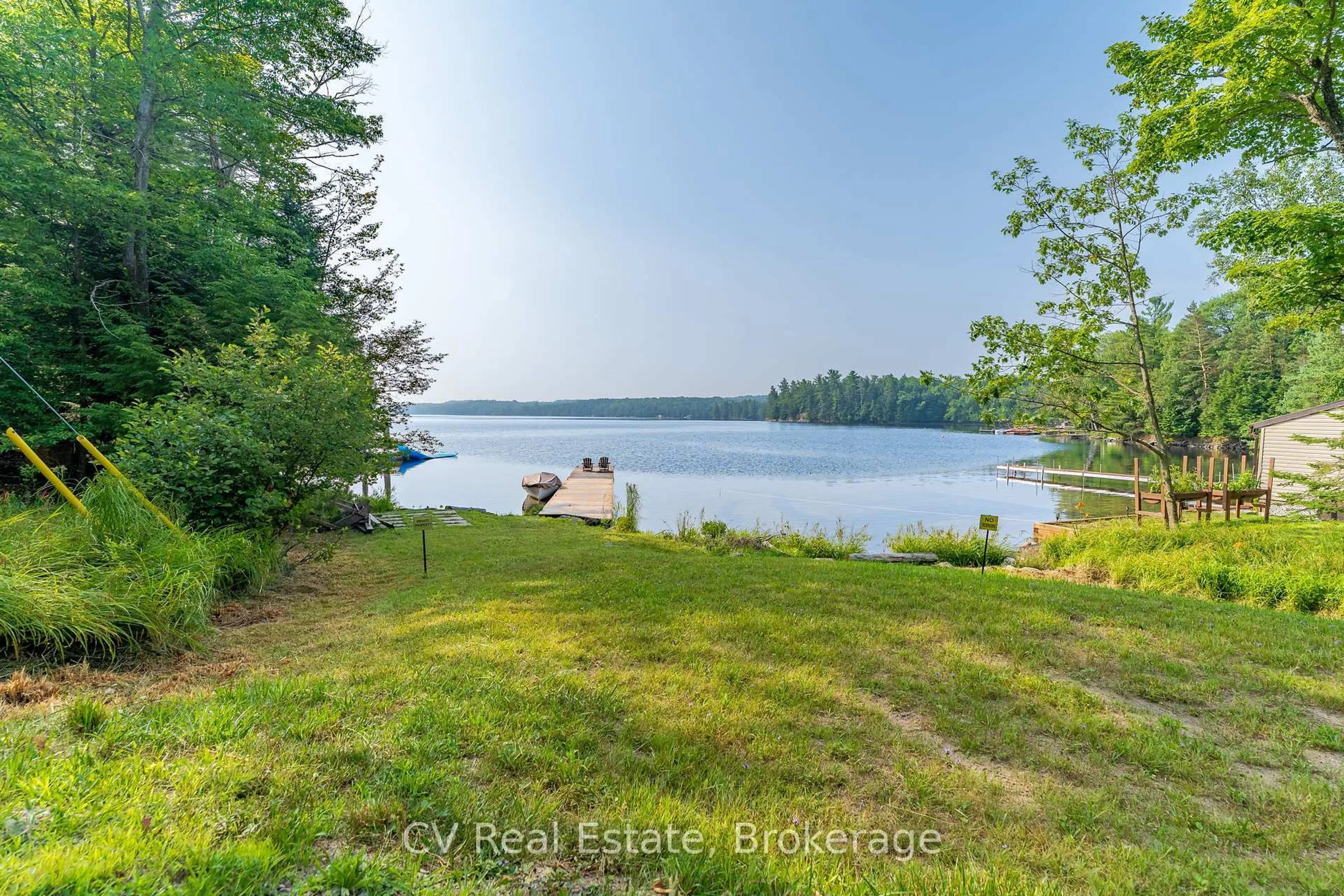 A pic from outside/outdoor area/front of a property/back of a property/a pic from drone, water/lake/river/ocean view for 1292 Port Cunnington Rd, Lake of Bays Ontario P0A 1H0