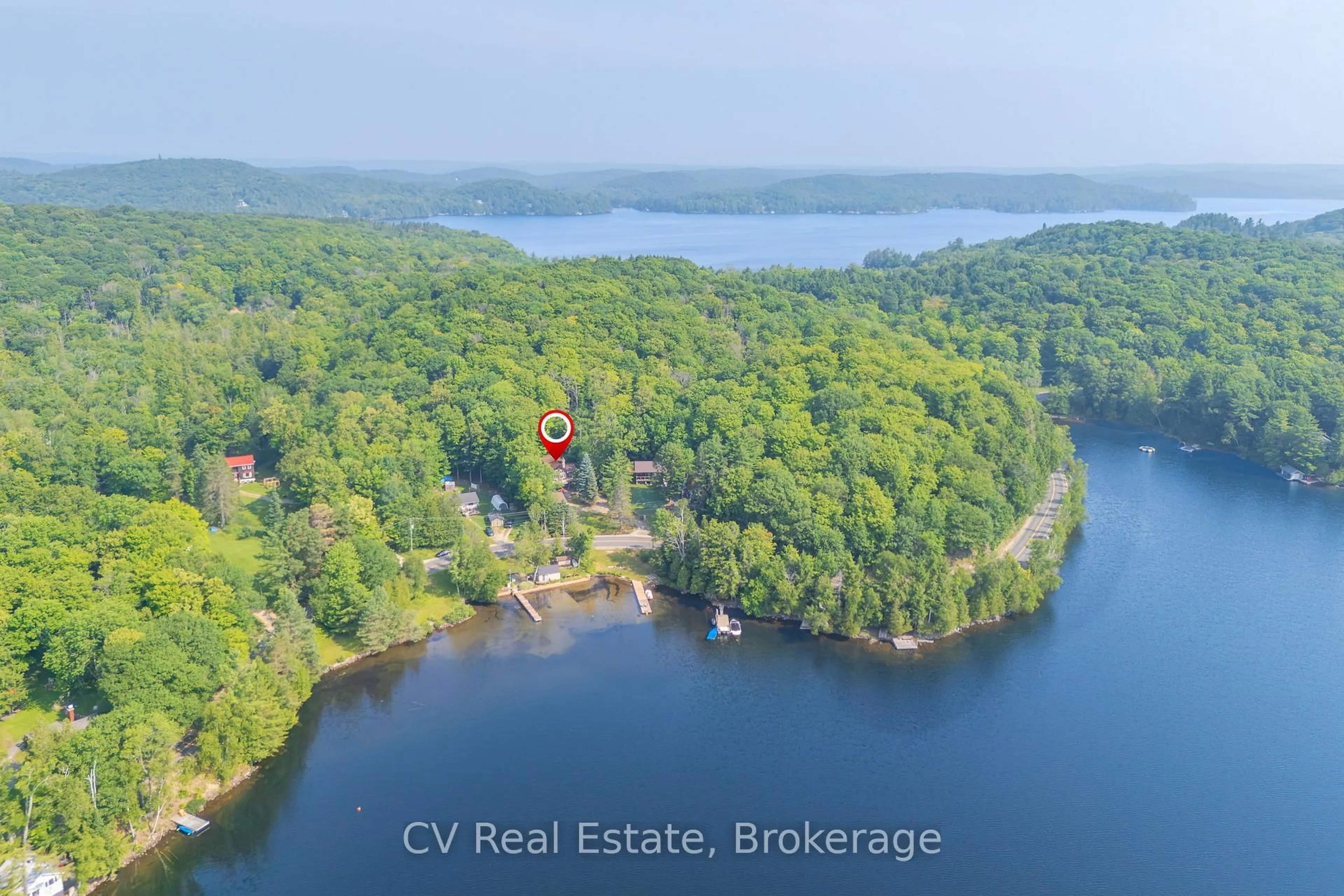 A pic from outside/outdoor area/front of a property/back of a property/a pic from drone, water/lake/river/ocean view for 1292 Port Cunnington Rd, Lake of Bays Ontario P0A 1H0