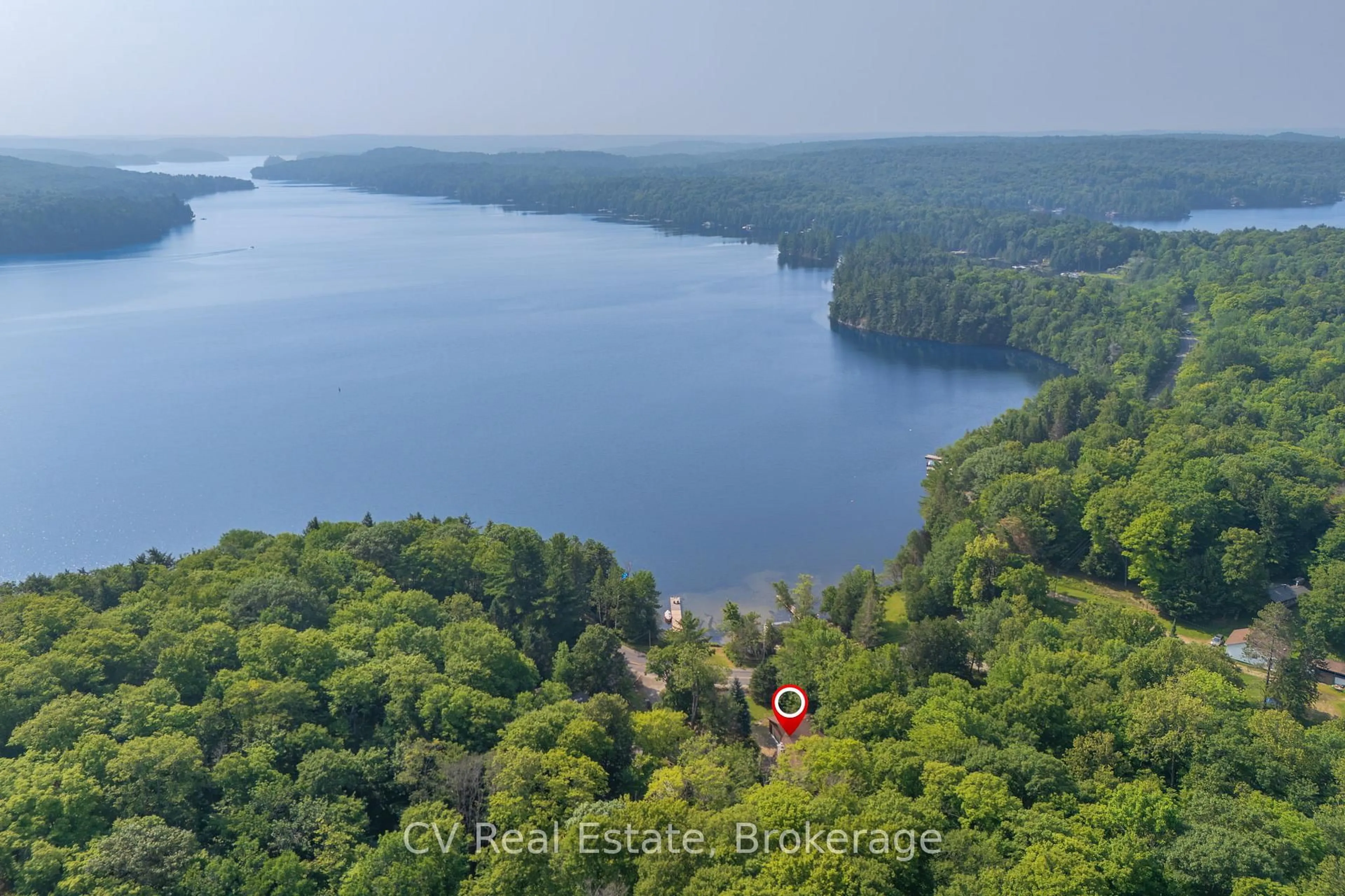 A pic from outside/outdoor area/front of a property/back of a property/a pic from drone, water/lake/river/ocean view for 1292 Port Cunnington Rd, Lake of Bays Ontario P0A 1H0