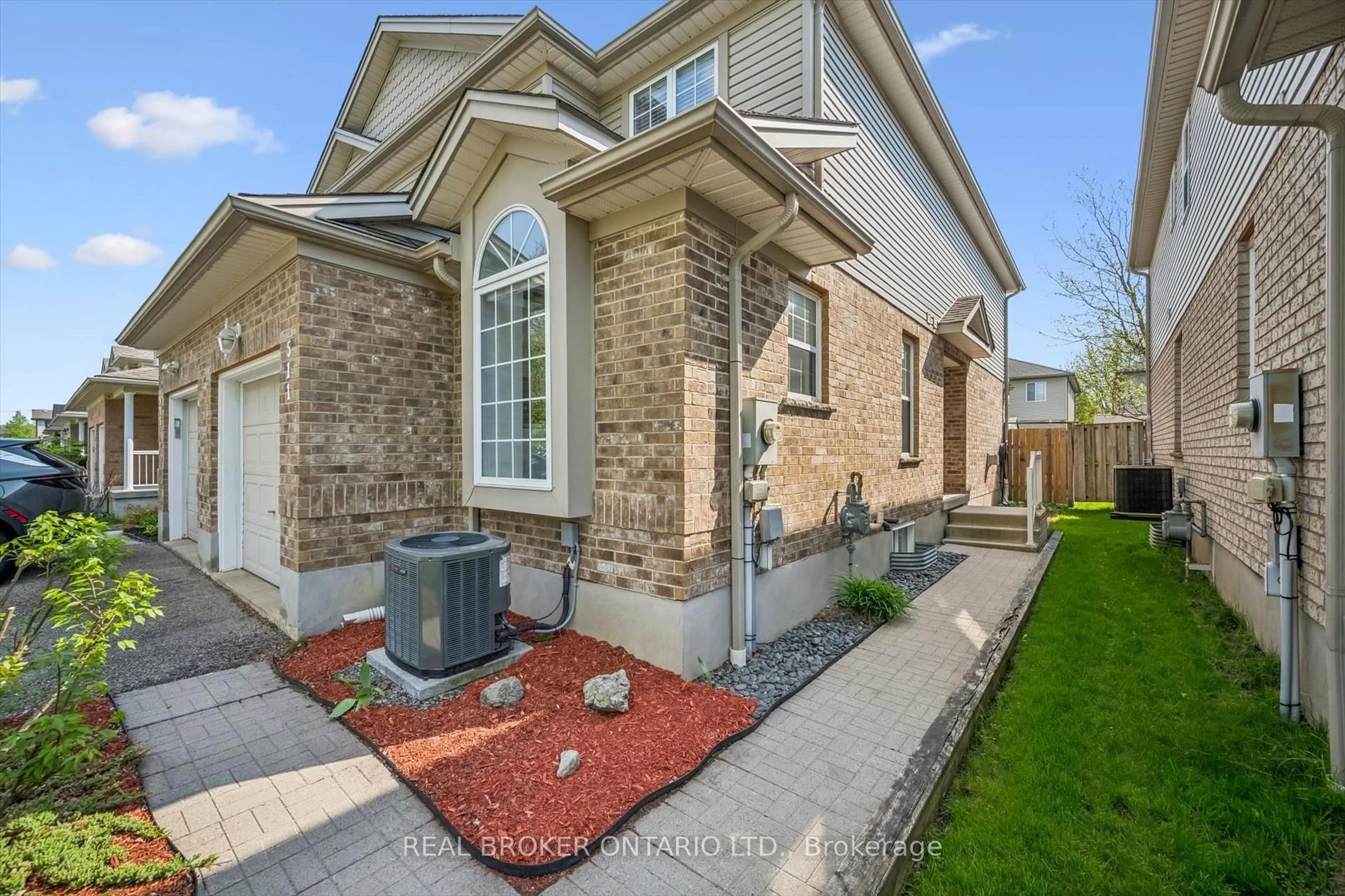 Home with brick exterior material, street for 511 Dansbury Dr, Waterloo Ontario N2K 4K8