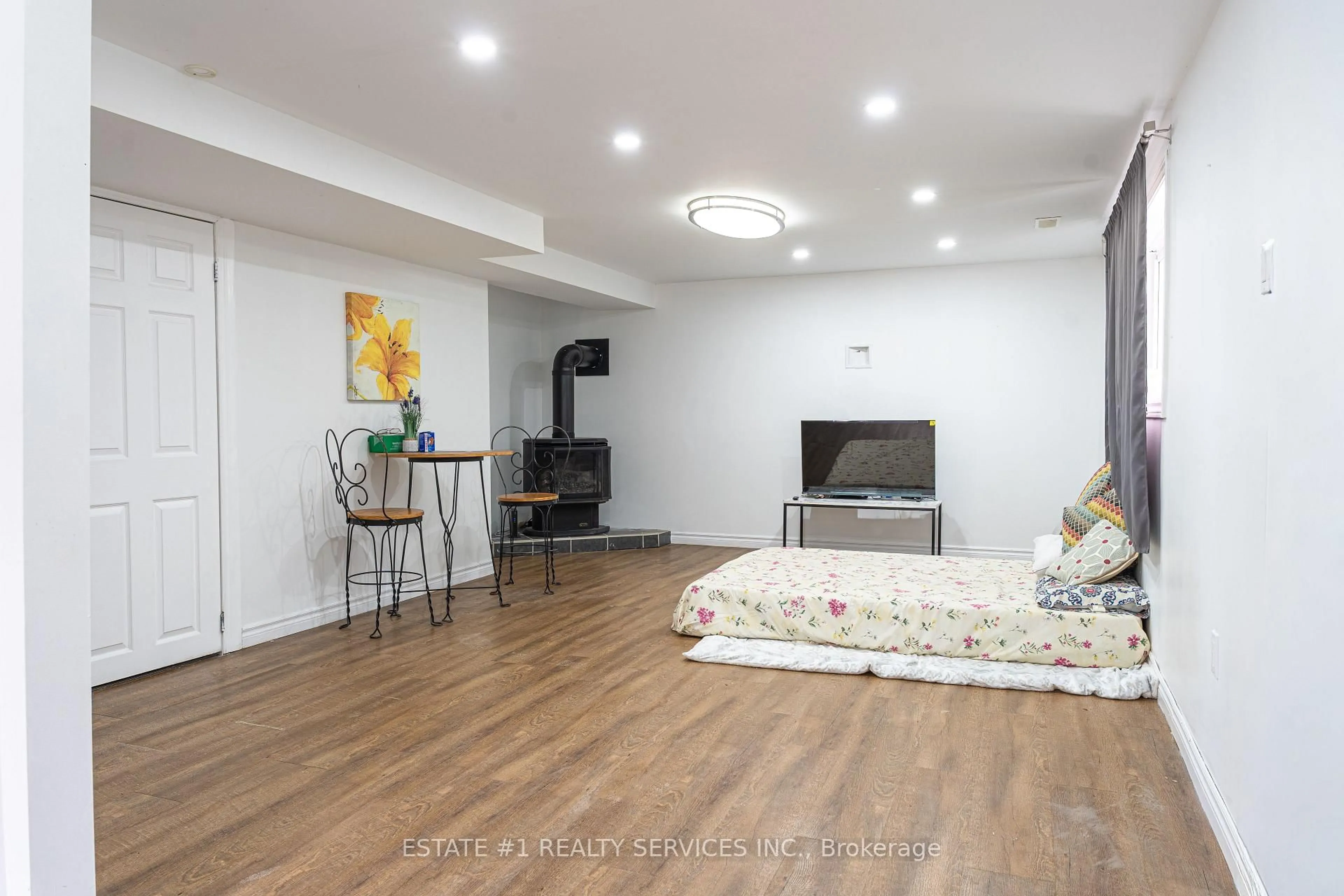 Living room with furniture, wood/laminate floor for 43 Dyer St, St. Thomas Ontario N5R 5K2