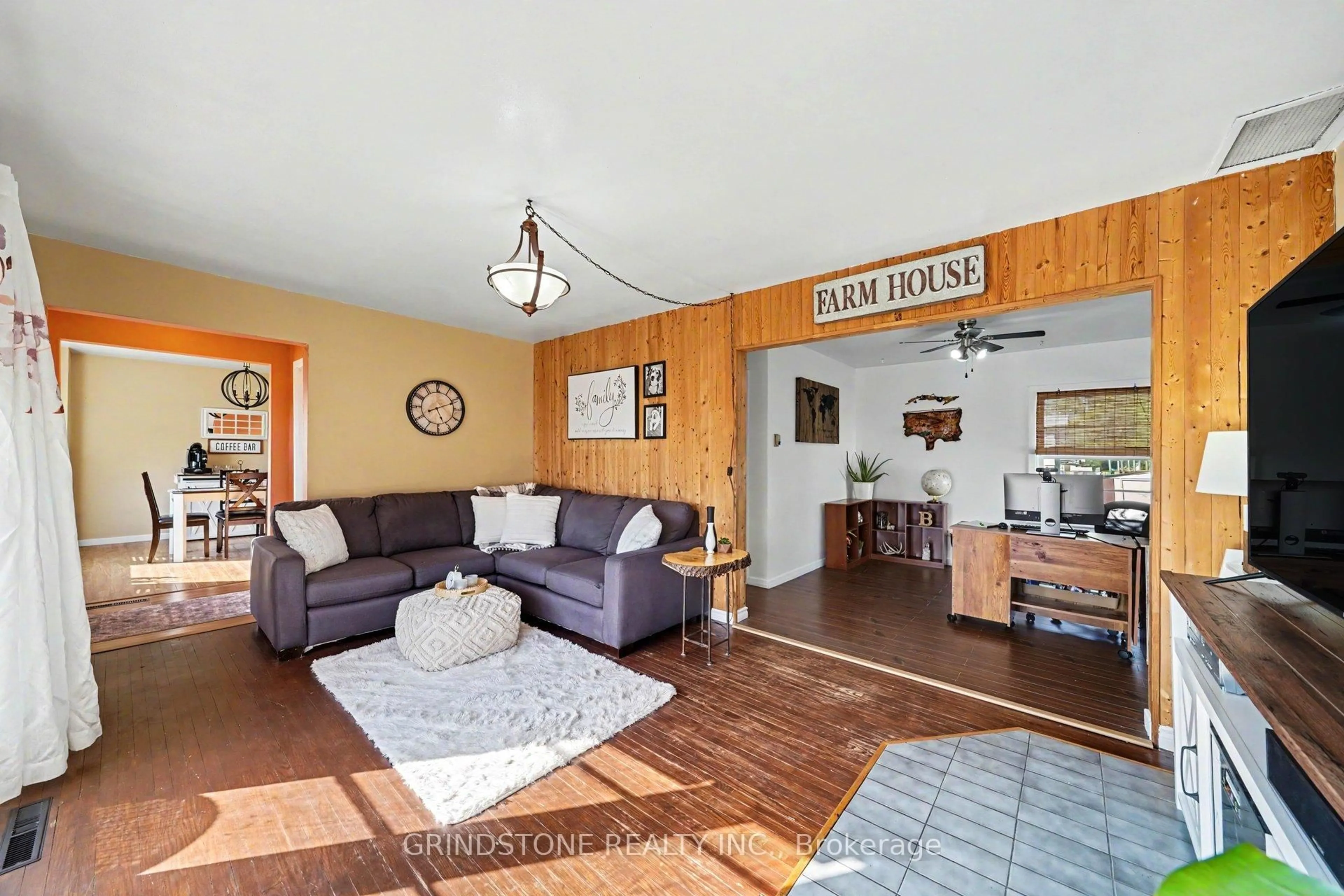 Living room with furniture, wood/laminate floor for 479 New St, Renfrew Ontario K7V 1G9